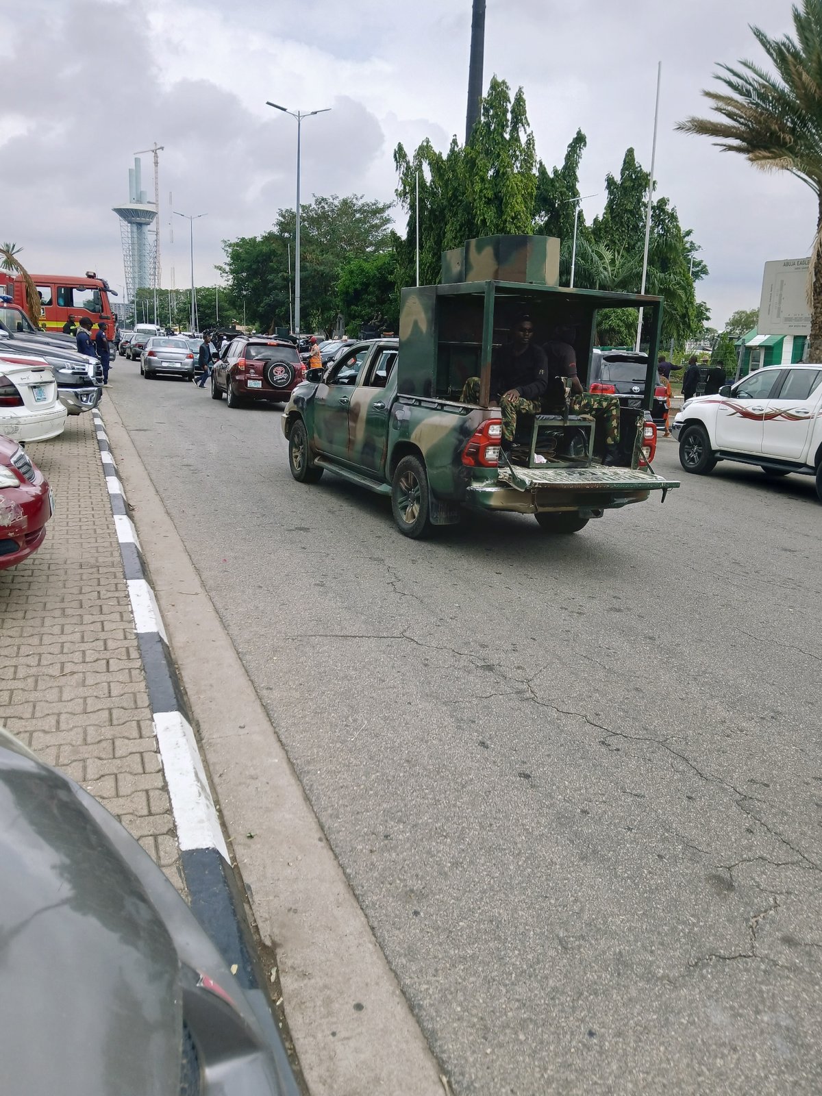 Civilians, military, police gather near Foreign Ministry in Abuja