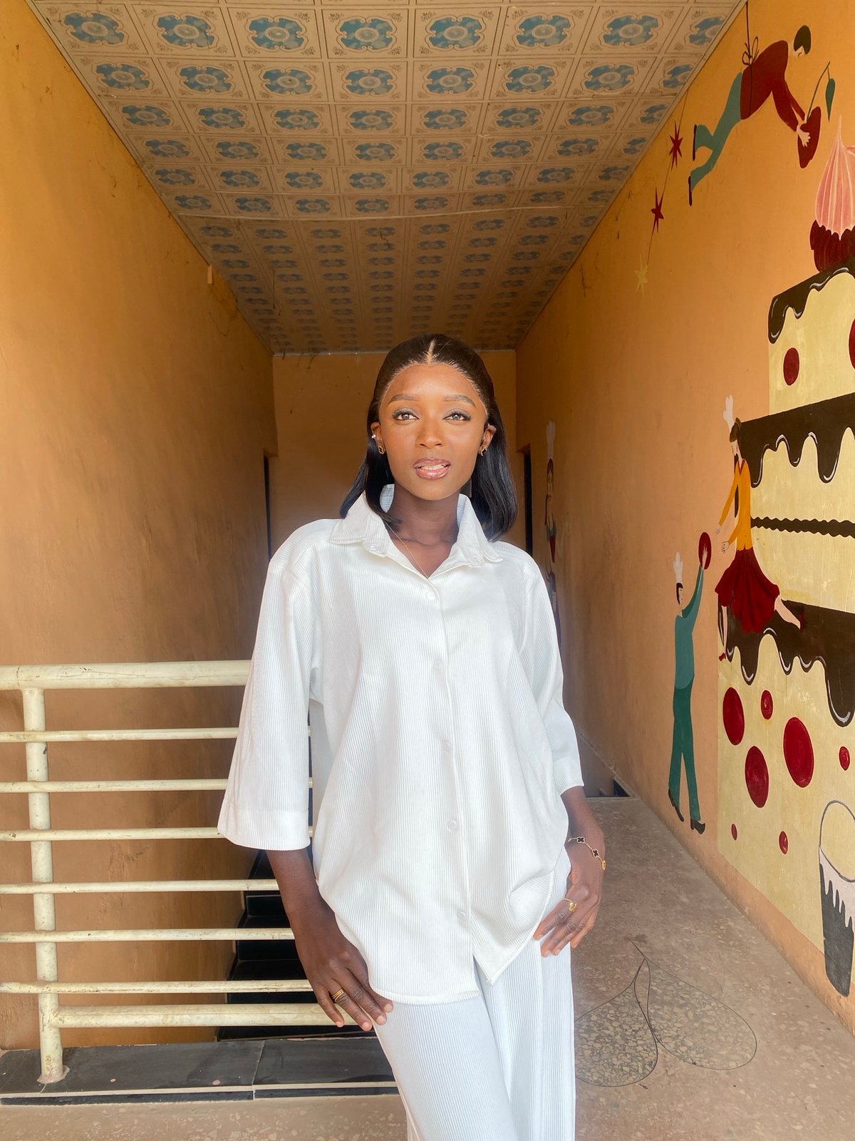 Fashion shoot across a decorated hallway and studio in Gura Top