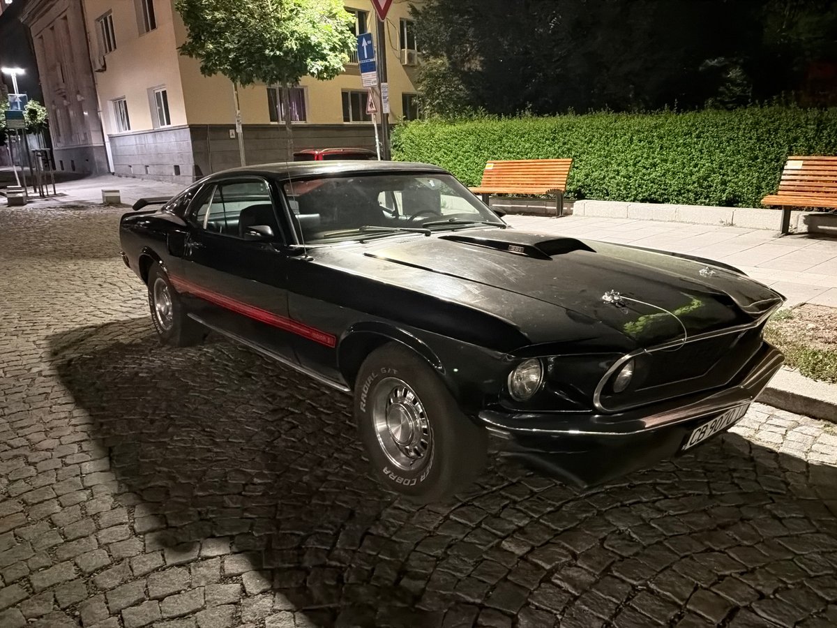 Evening photography tour captures illuminated Sofia landmarks and vintage Mustang