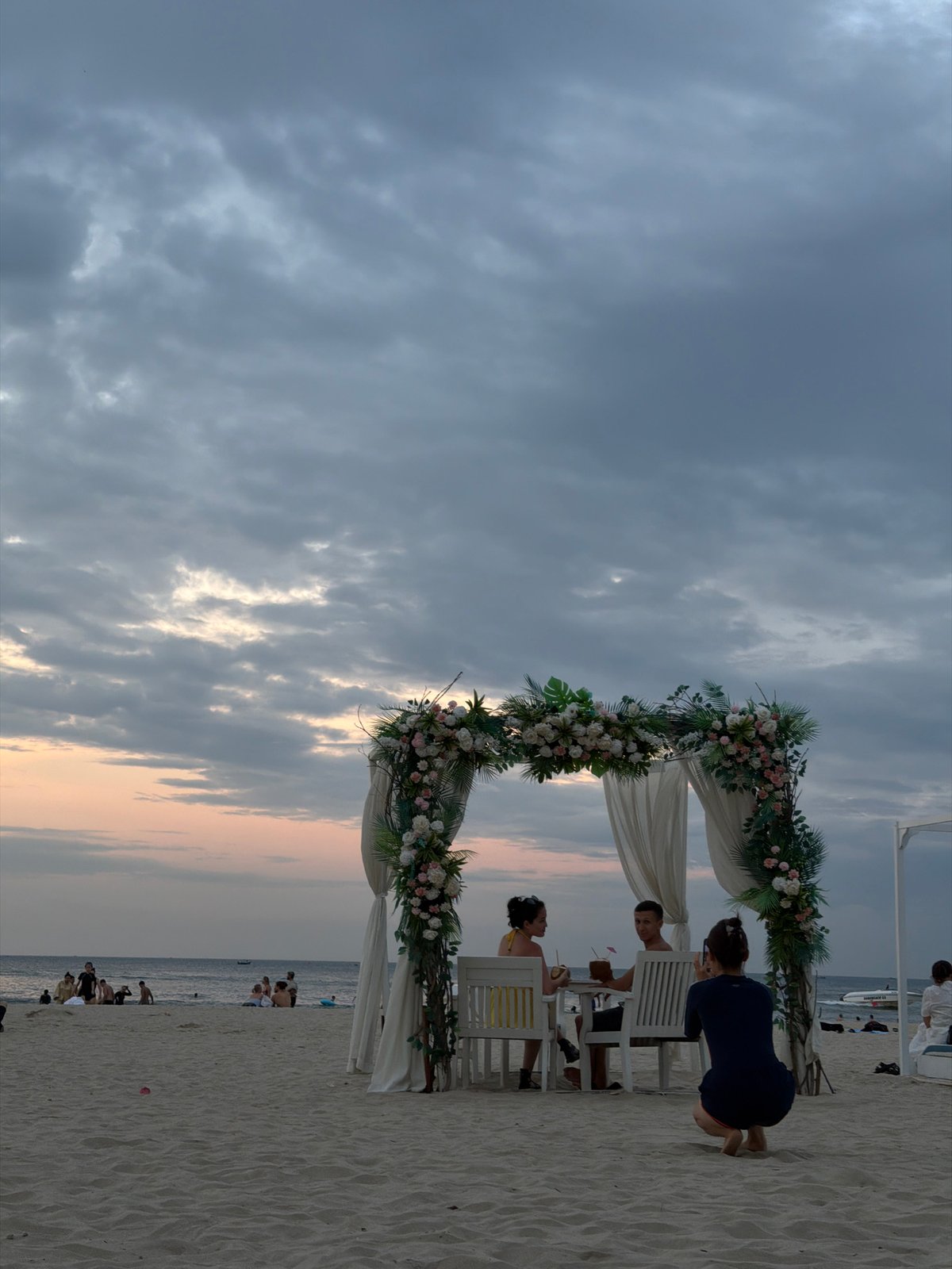 Busy evening at My Khe Beach under a stormy Đà Nẵng sky