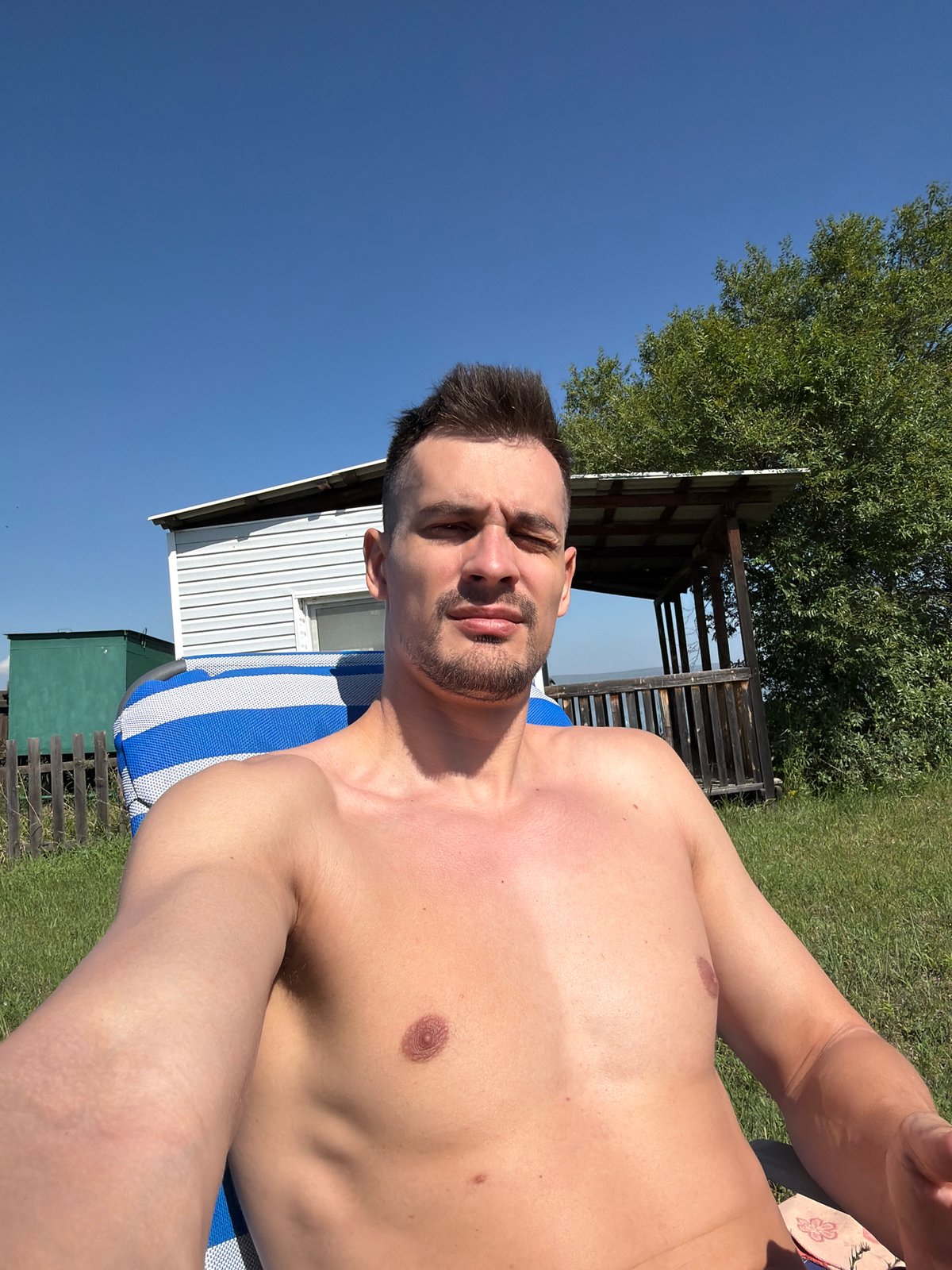 Sunny afternoon selfie session in a striped lounge chair, Russia