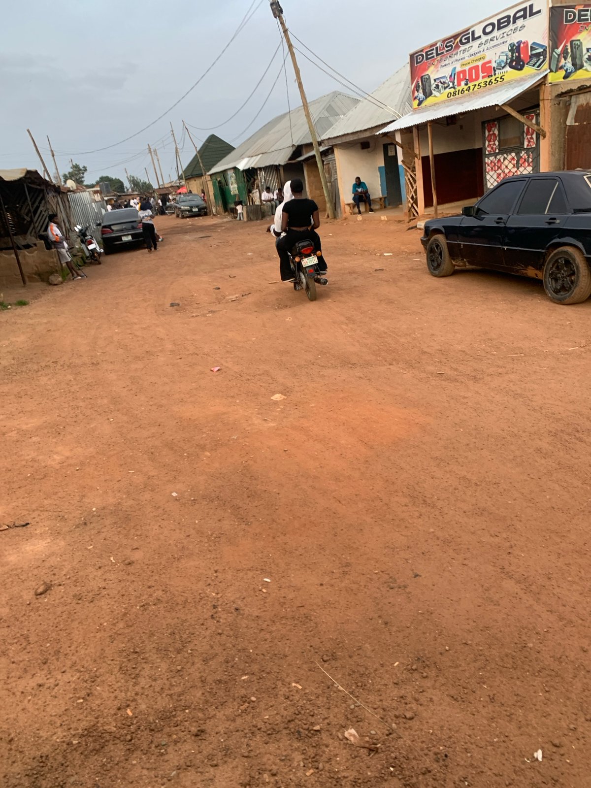 Street life along dusty roads in Bukuru and Du, Nigeria