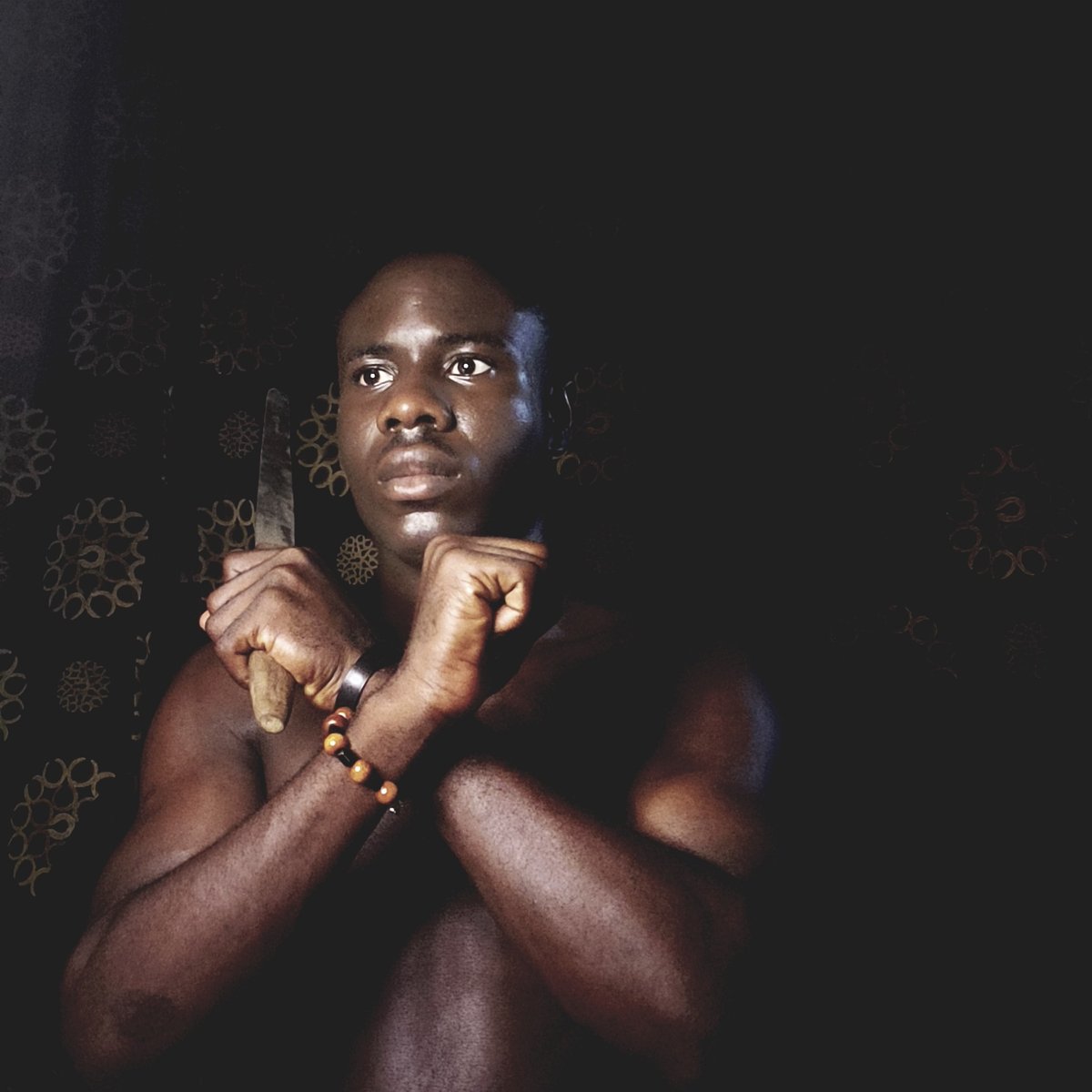 Person resting on patterned surface in Narayi, Nigeria