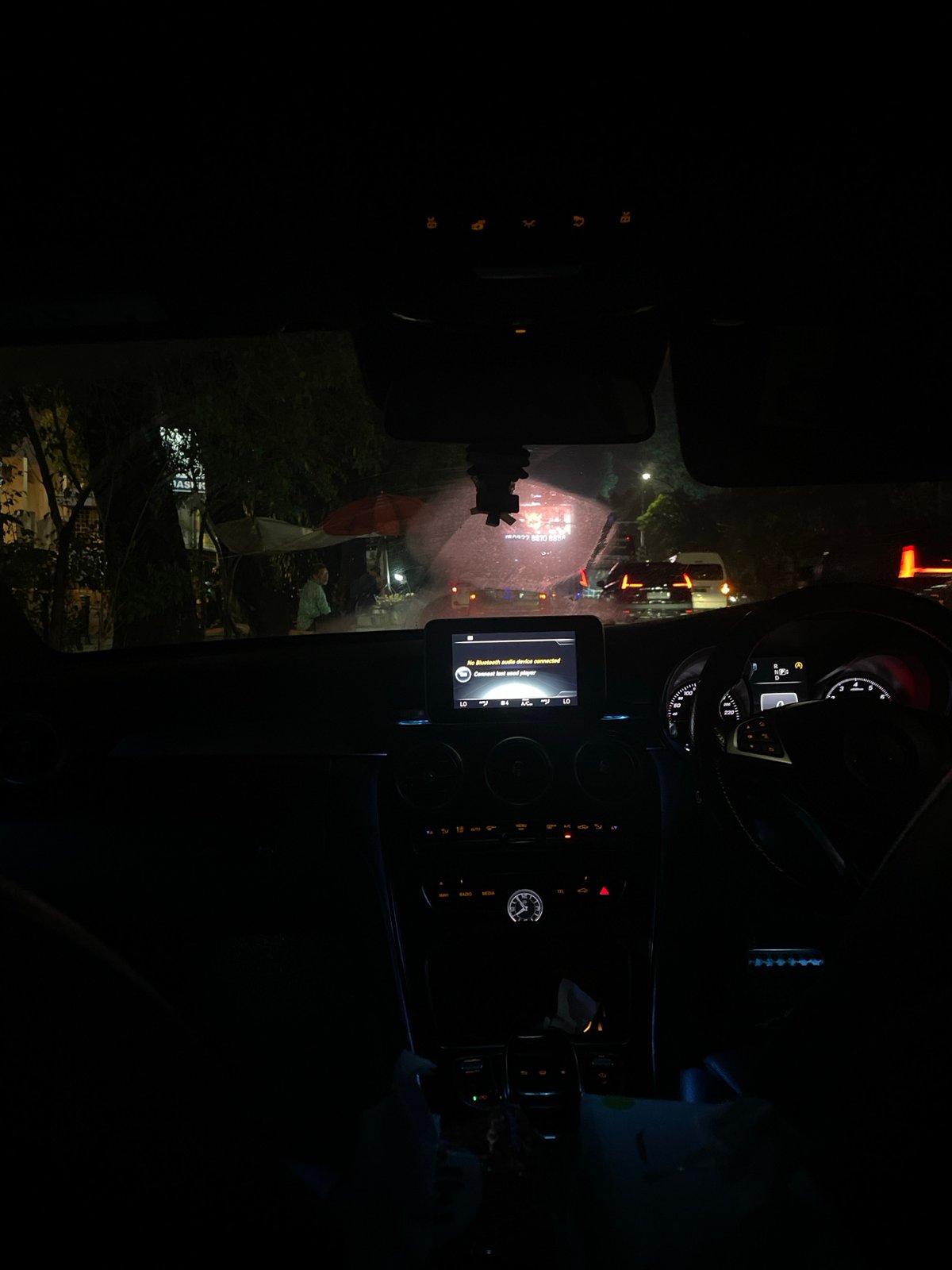 Nighttime drive through Bogor captured from inside vehicle