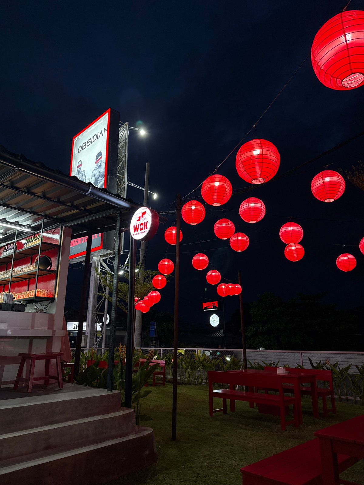 Evening dining scene with festive lanterns captured in Munggu