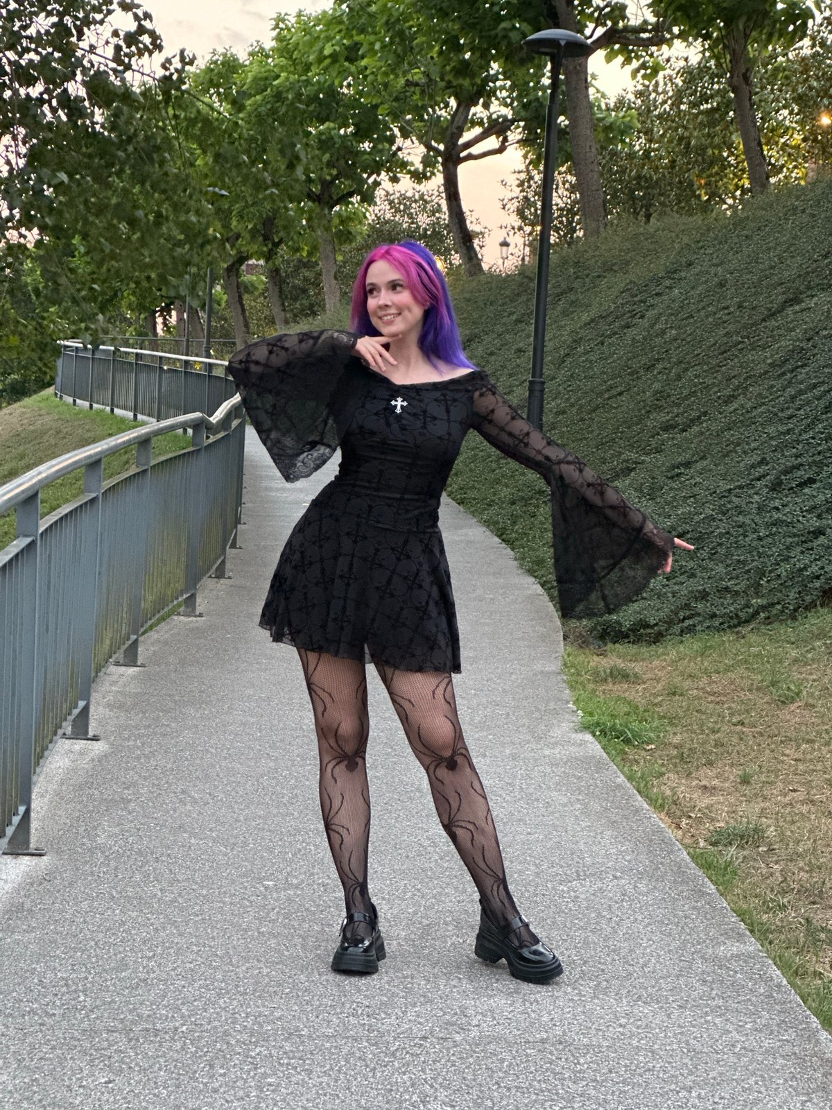 Gothic fashion shoot on a paved walkway in Oviedo