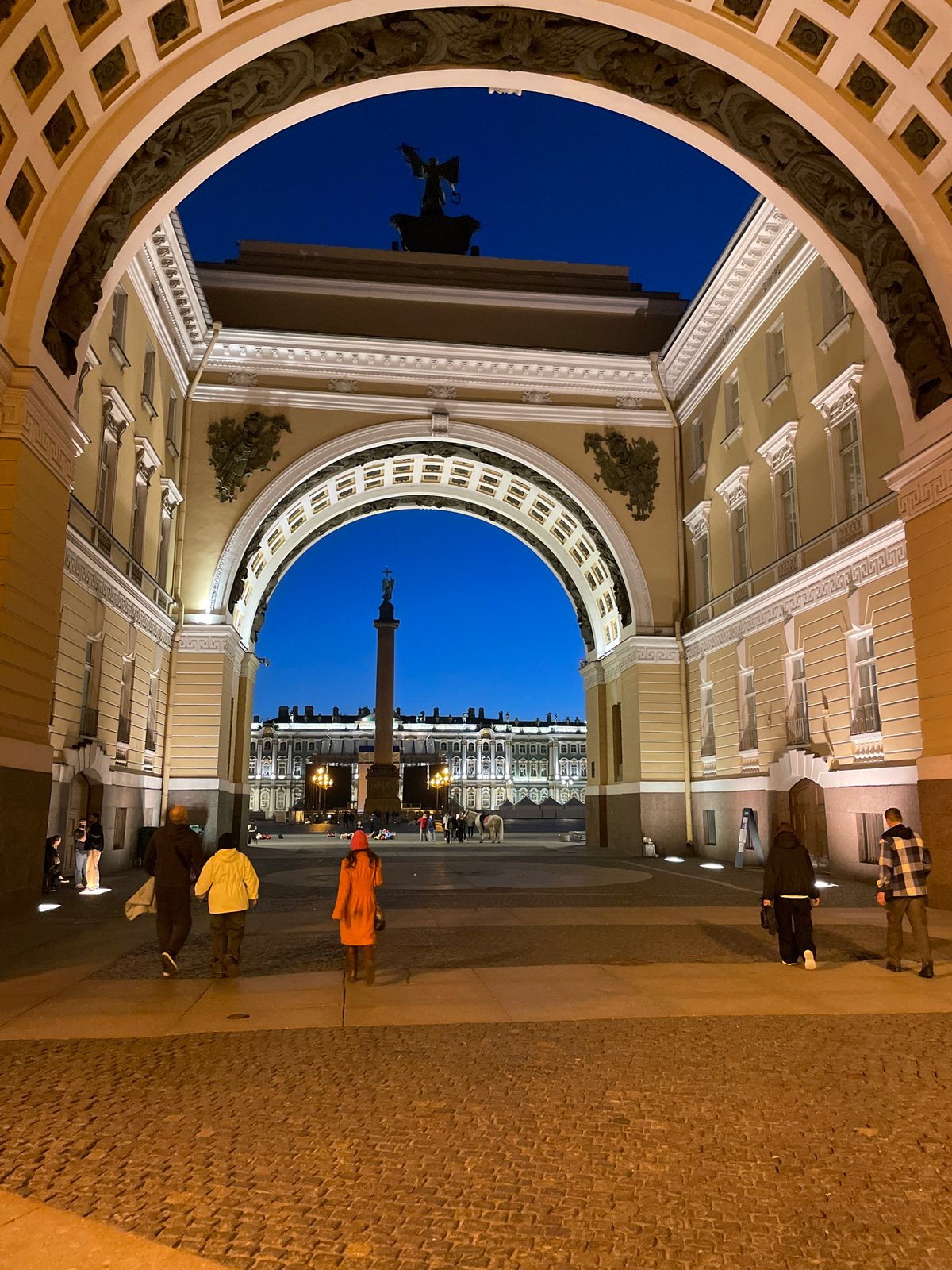 Evening balloon display illuminates historic European city square