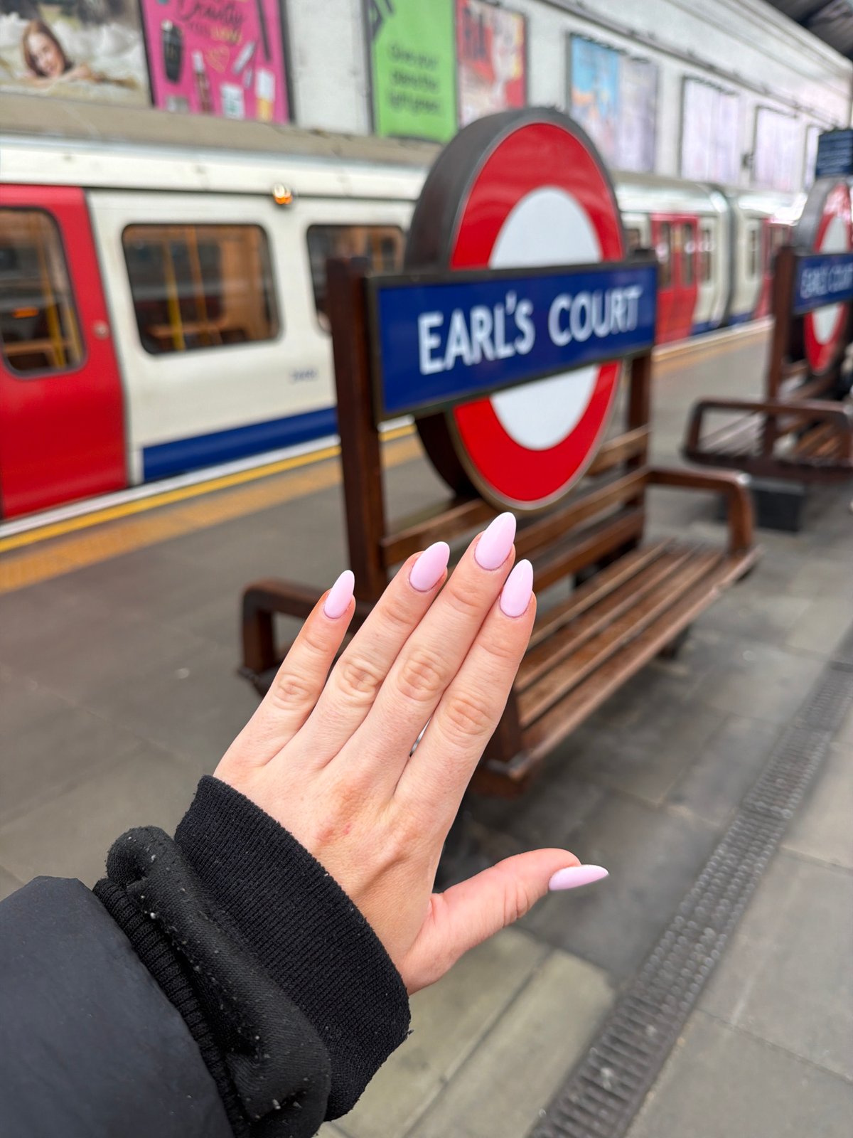 Woman photographed at Earl's Court Underground station in London