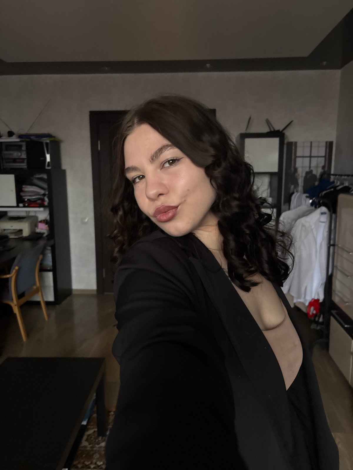 Woman takes selfies indoors in Perm residential space