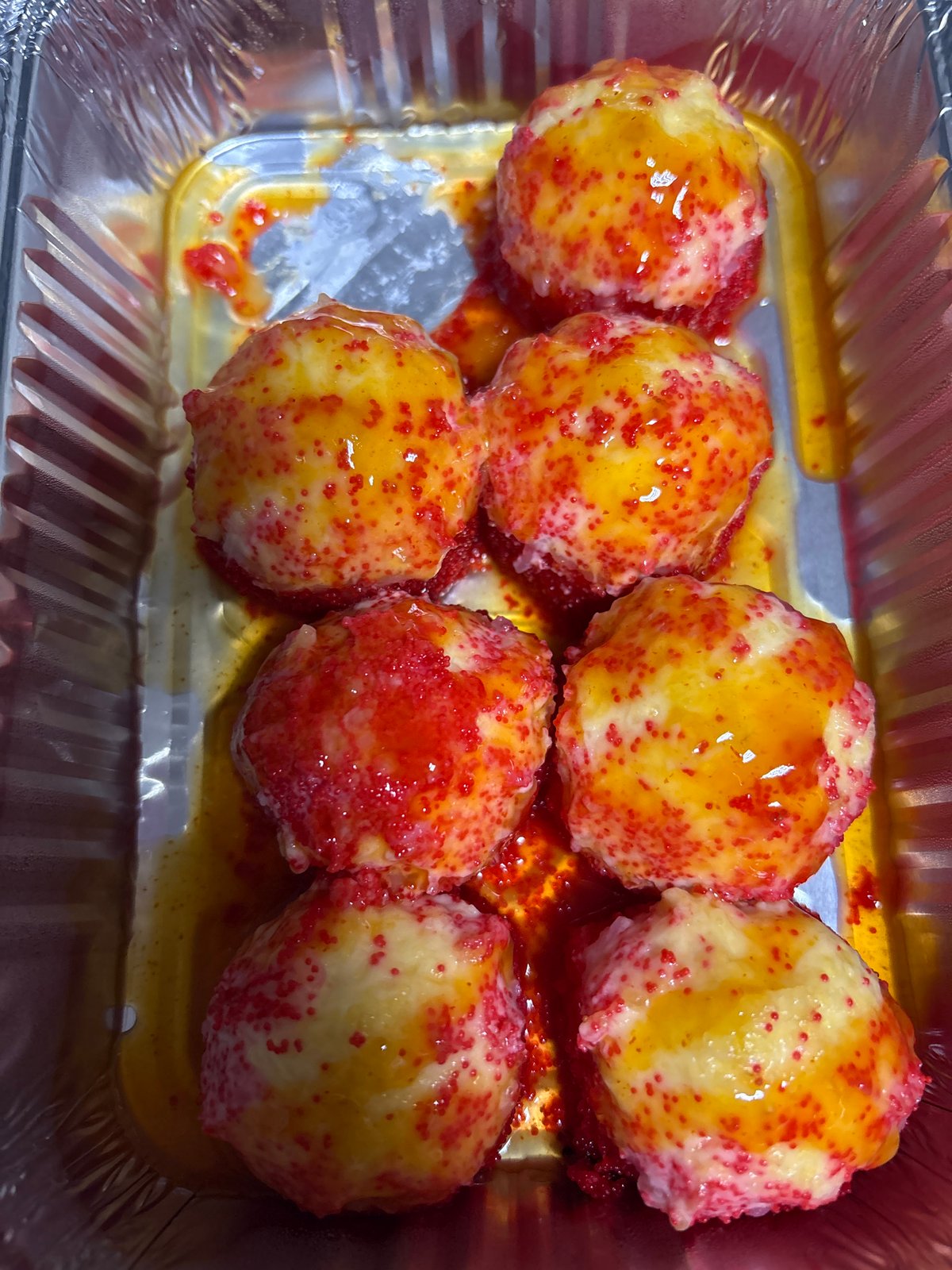 Glazed baked goods spotted in foil container in Ust-Ilimsk