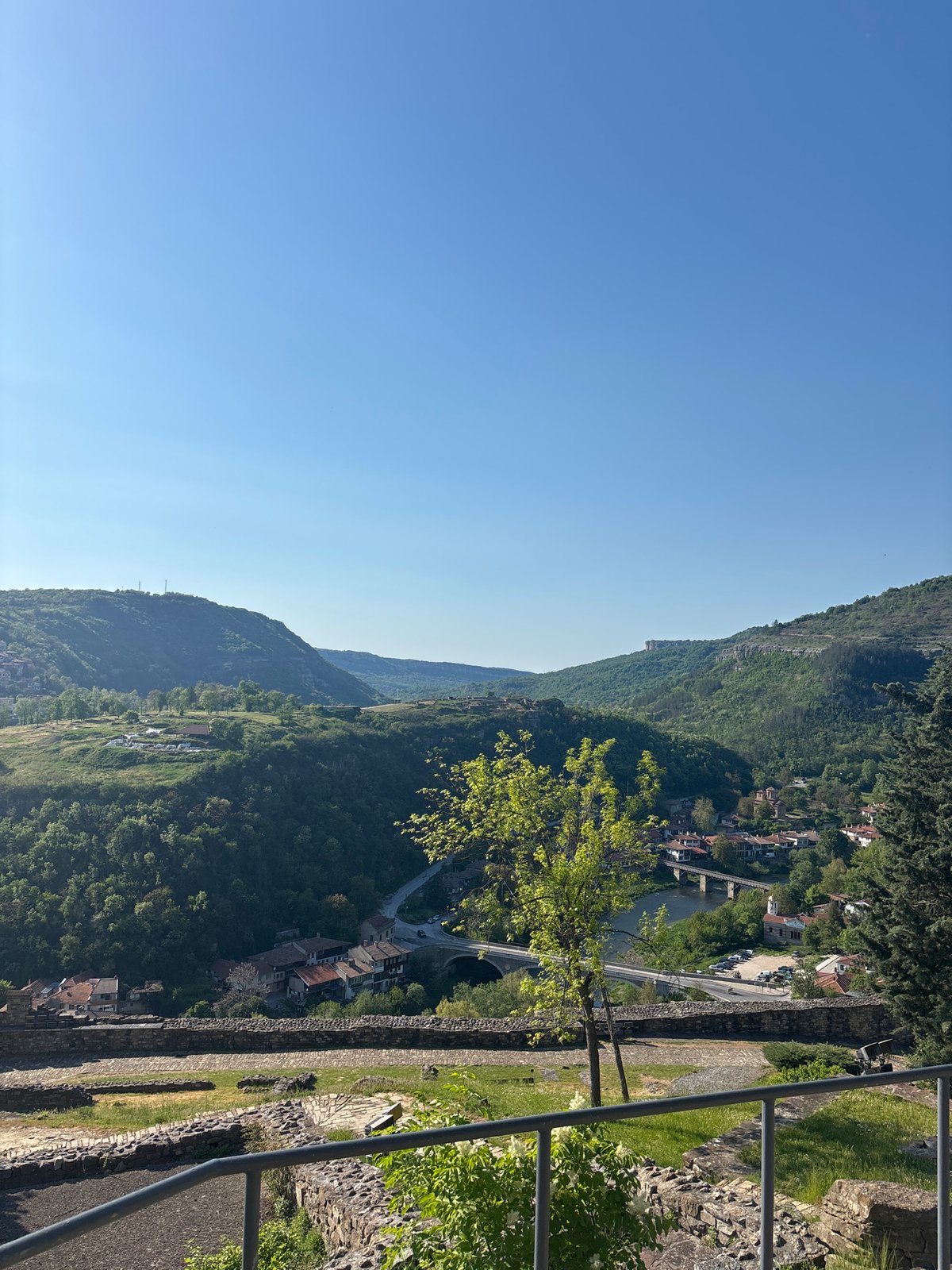 Tourist captures panoramic views of historic Veliko Tarnovo from fortress