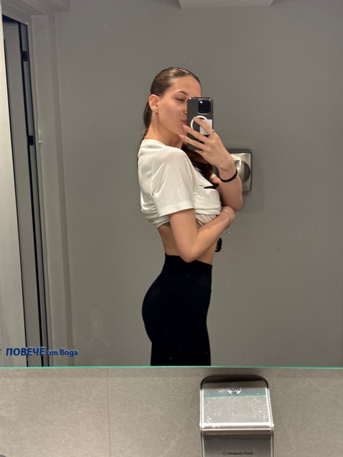 Woman takes mirror selfies in Sofia locker room facility