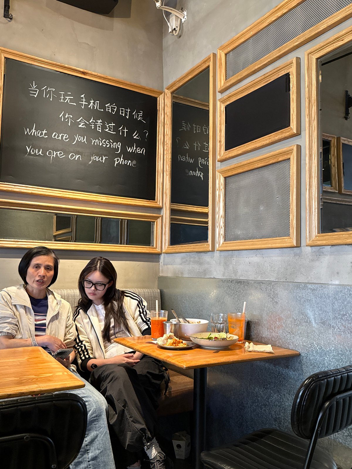 Women share green smoothies at early morning cafe in Yuzhong