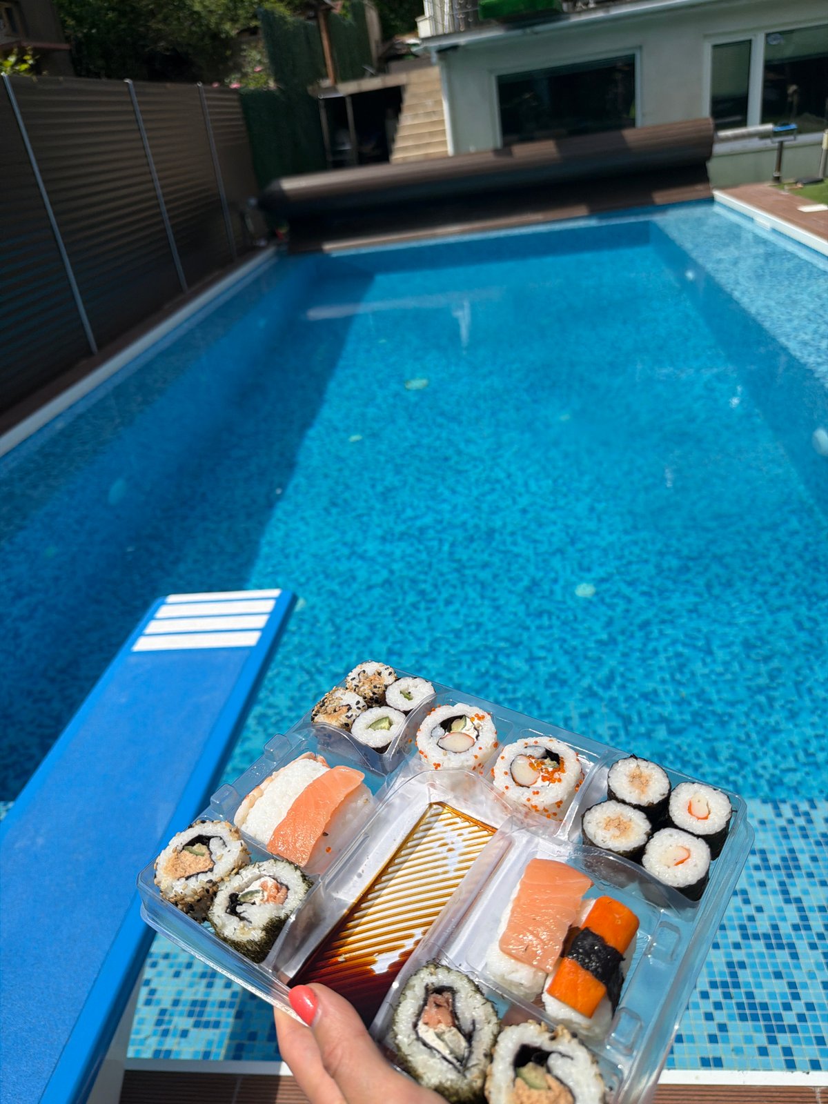 Sushi lunch enjoyed poolside in Sofia residential backyard
