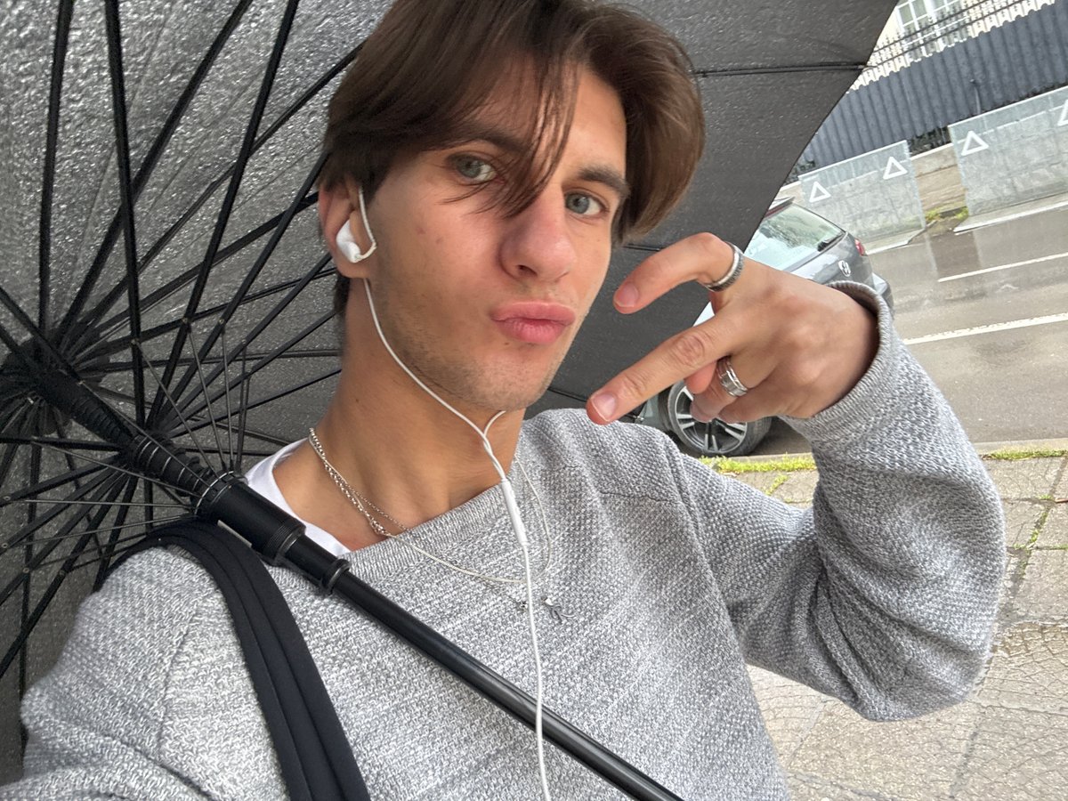 Young man takes selfie on overcast Sofia street