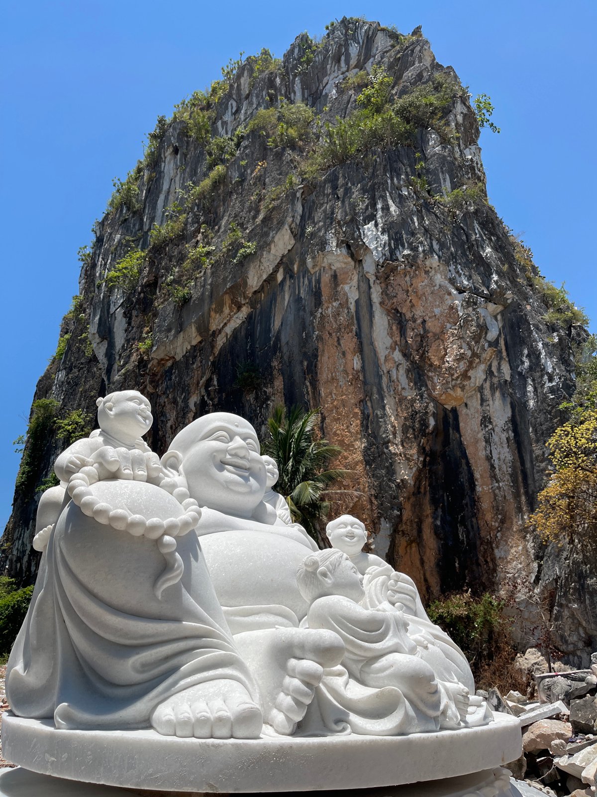 Tourist documents Buddhist statues at Đà Nẵng's Marble Mountains