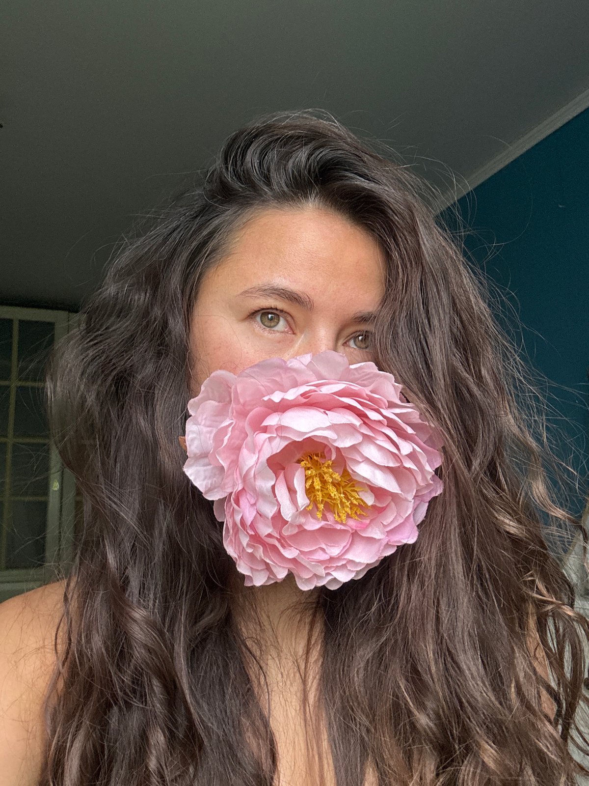 Portrait with pink flower documented in Kazan, Russia