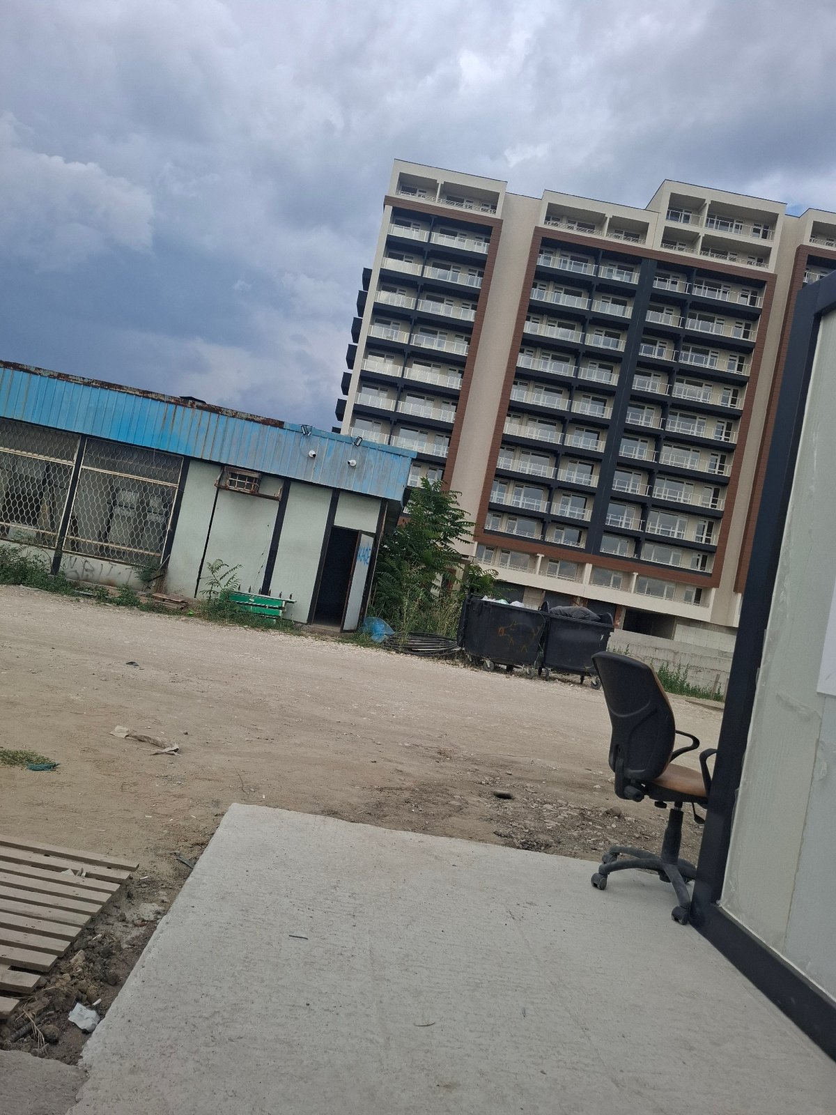 Plovdiv neighborhood mid-build: cranes, apartments, and street life