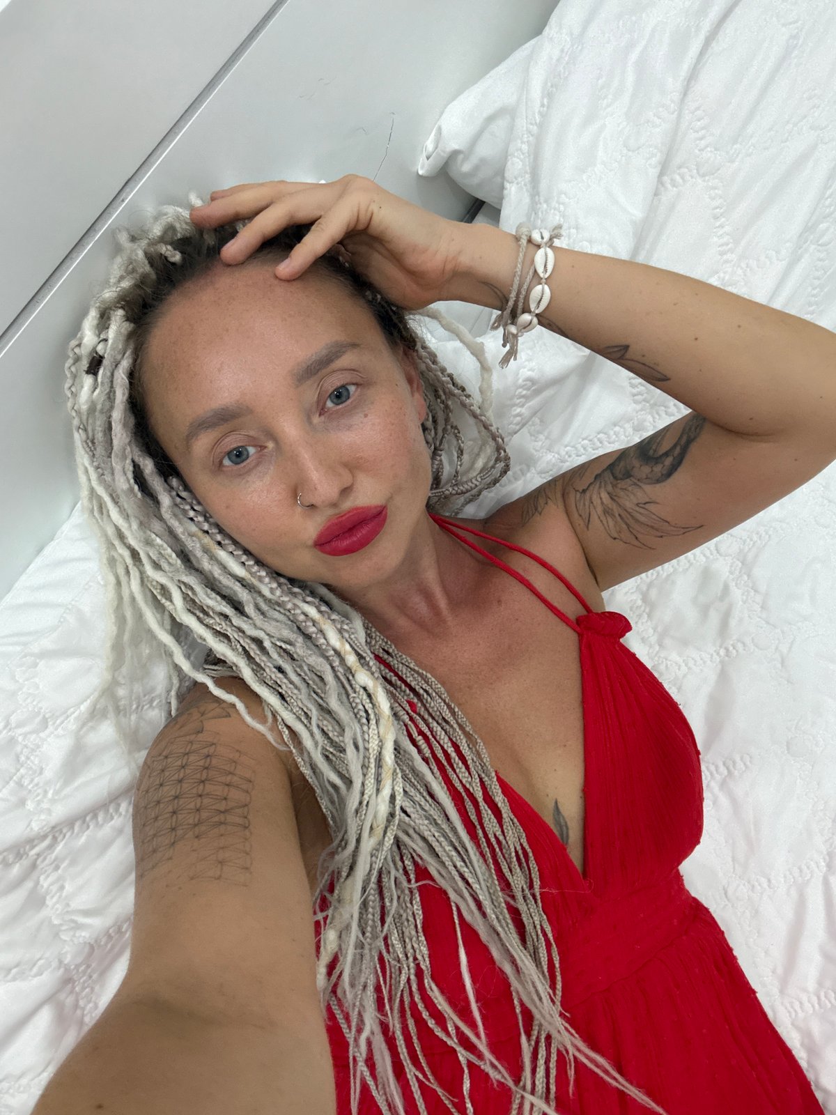Bedroom selfie session in Nha Trang with a small dog