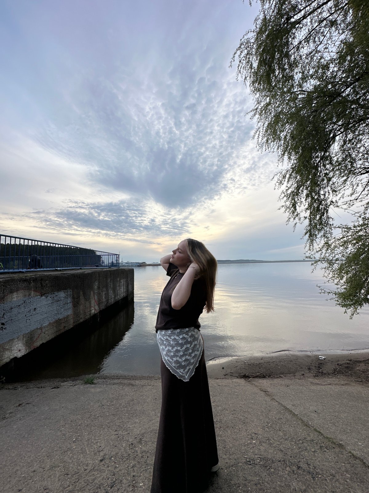 Woman photographed at Kama River waterfront in Chaikovsky, Russia