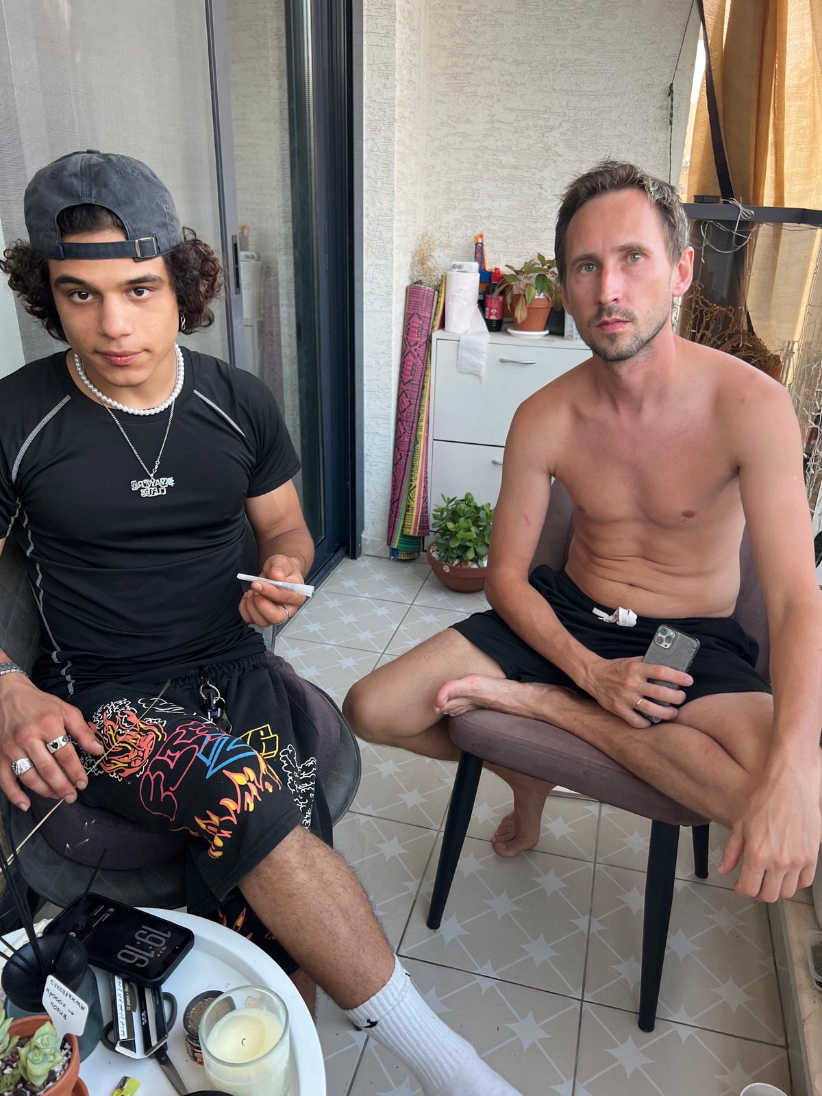 Balcony hangout in Kiryat Bialik, cigarettes and phones