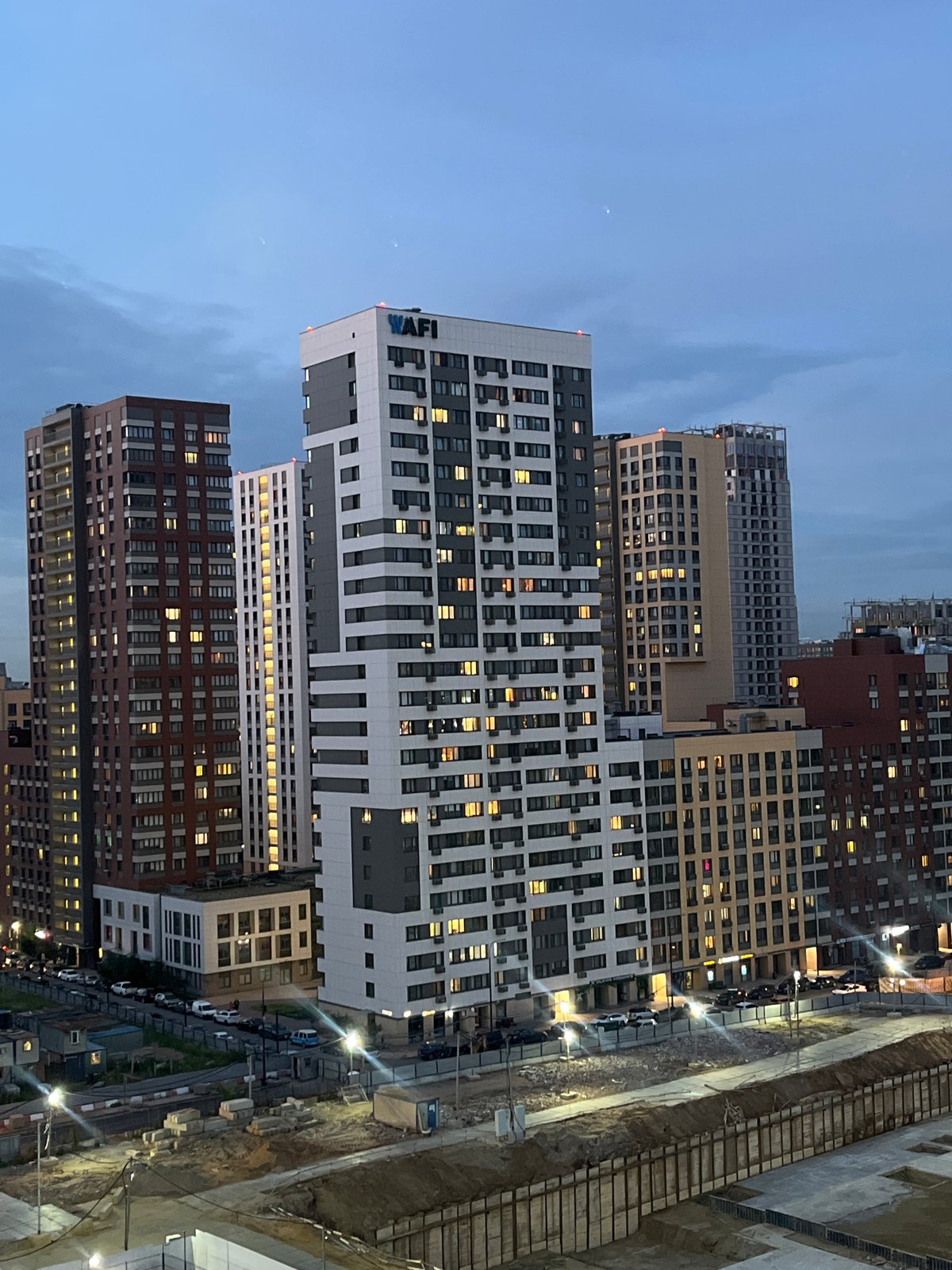 High-rise construction underway at dusk in Tarasovka, Russia