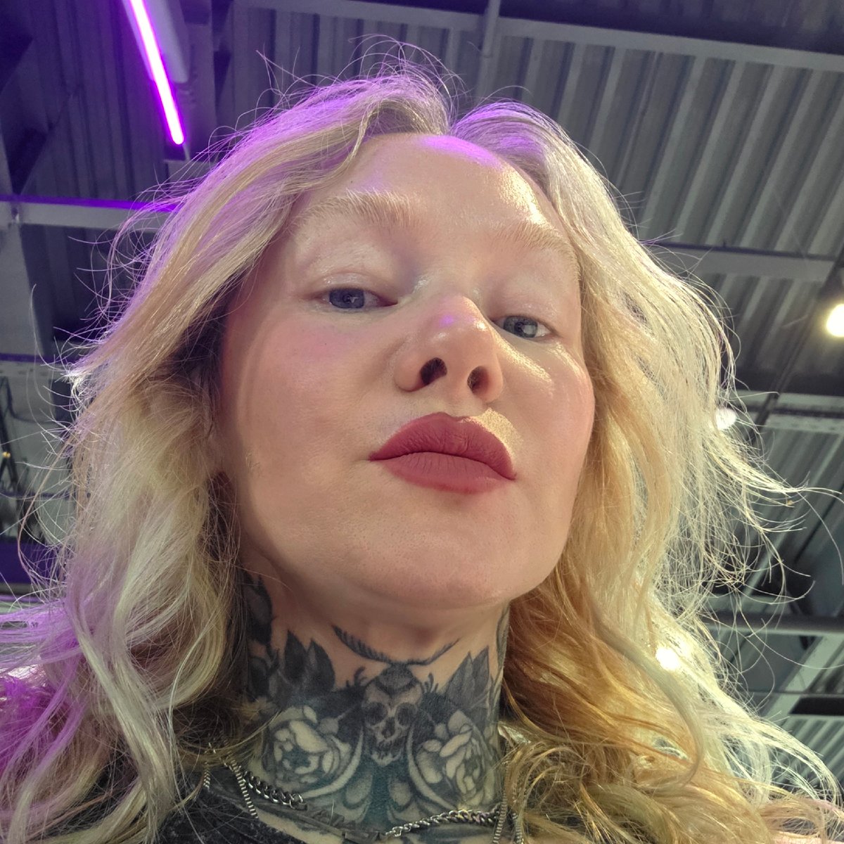 Tattooed blonde woman photographed at multiple Saint Petersburg locations