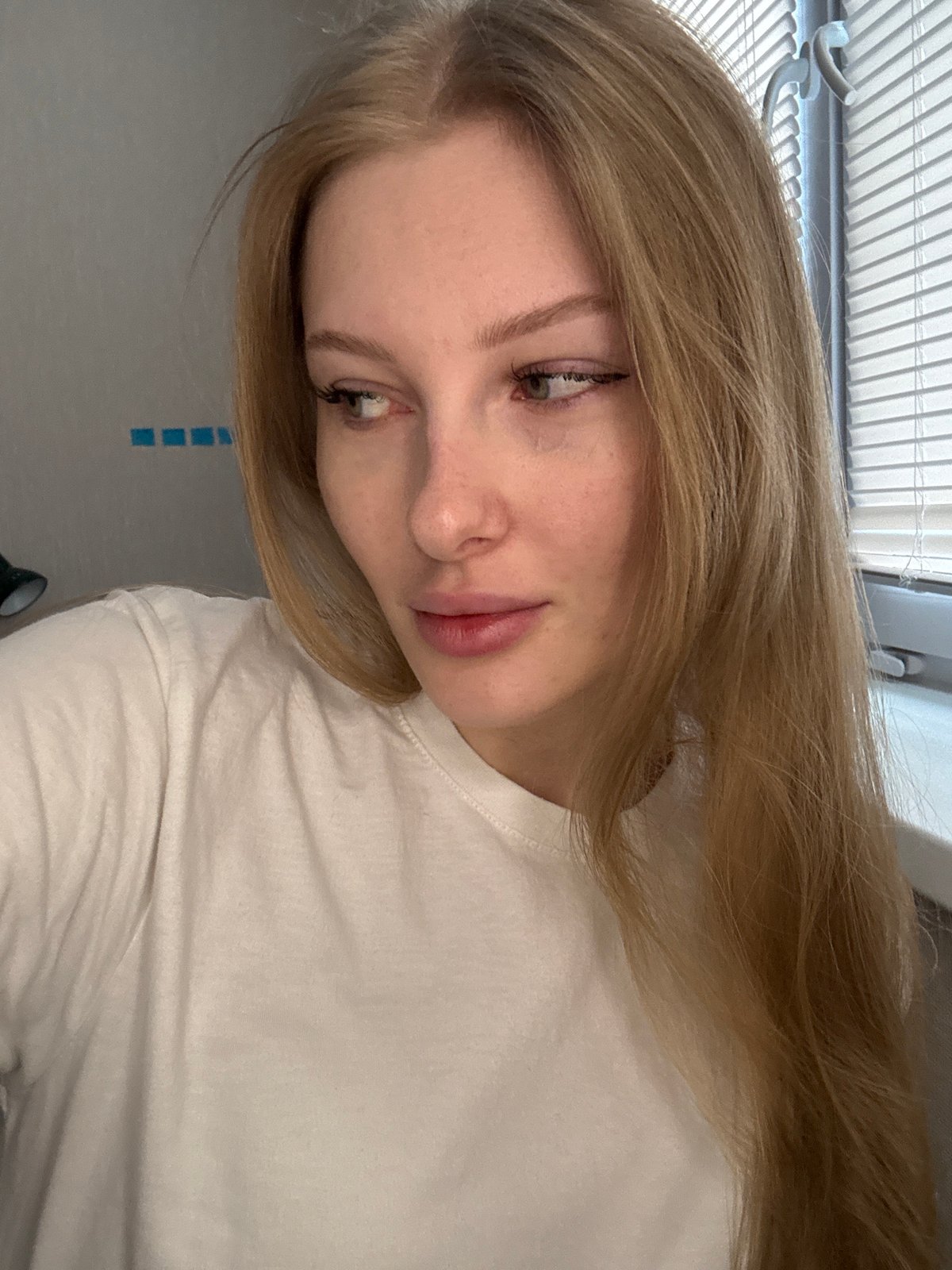 Woman takes multiple selfies in Perm early morning
