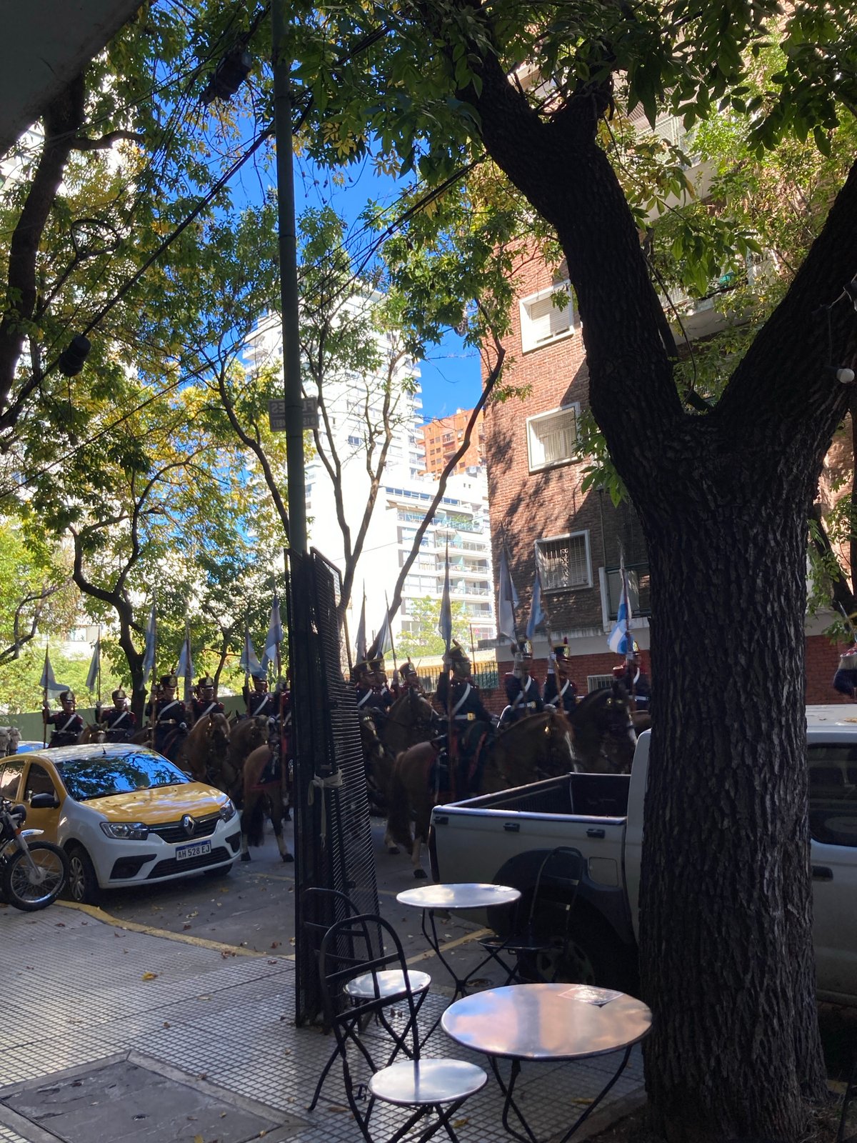 Ceremonial cavalry procession moves through city streets