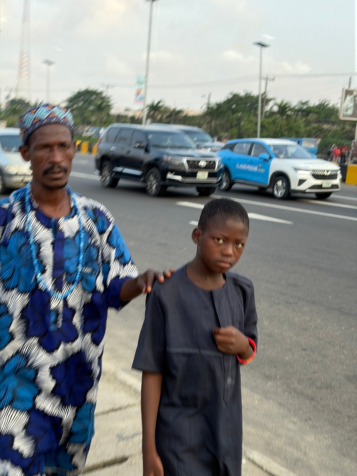 Two people on a paved road in Igboefon, Nigeria