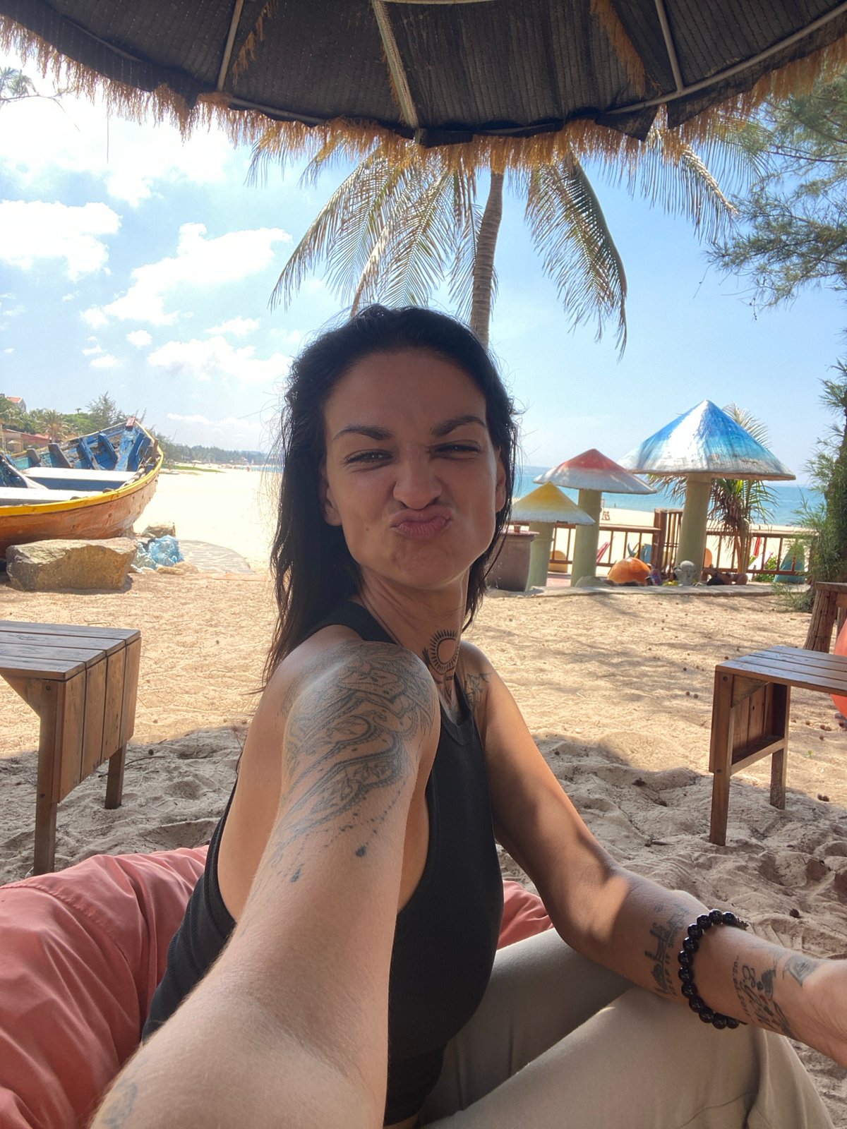 Woman takes beach selfies on beanbag in Vietnam