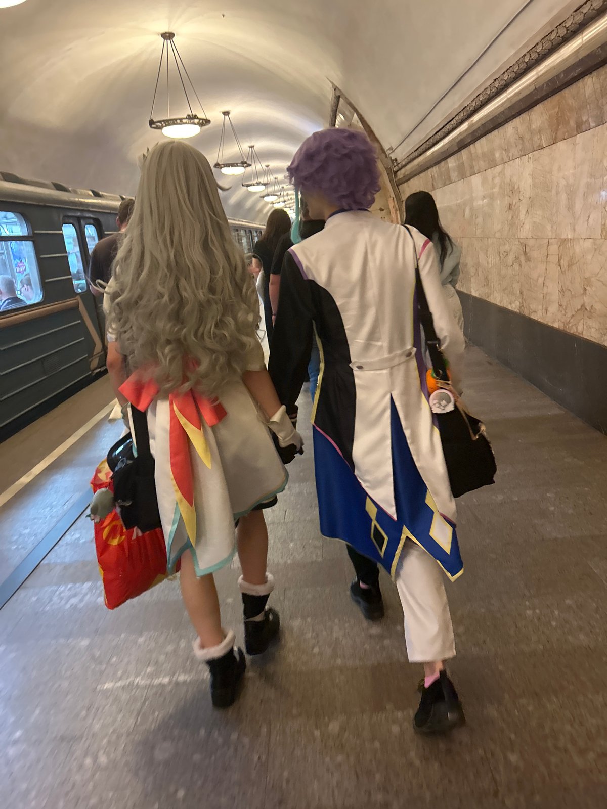 Cosplayers and street scenes near ornate Moscow-style architecture