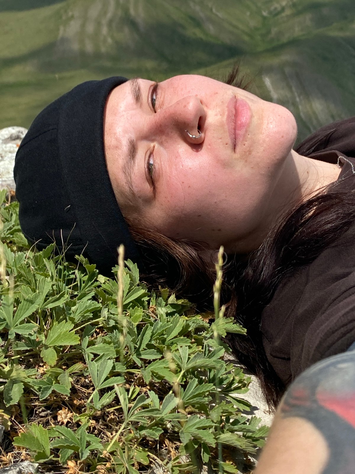 Woman documents solo hillside moment with selfies in Russia