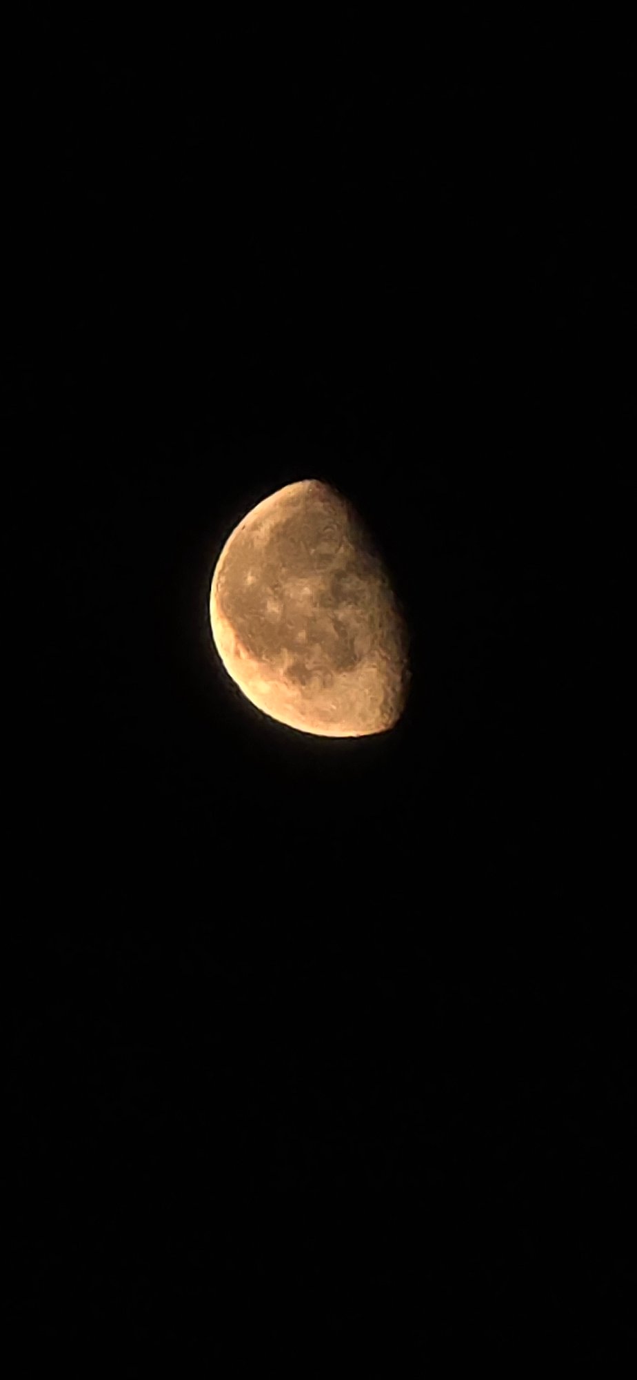 Volgograd night: illuminated monument and an orange moon