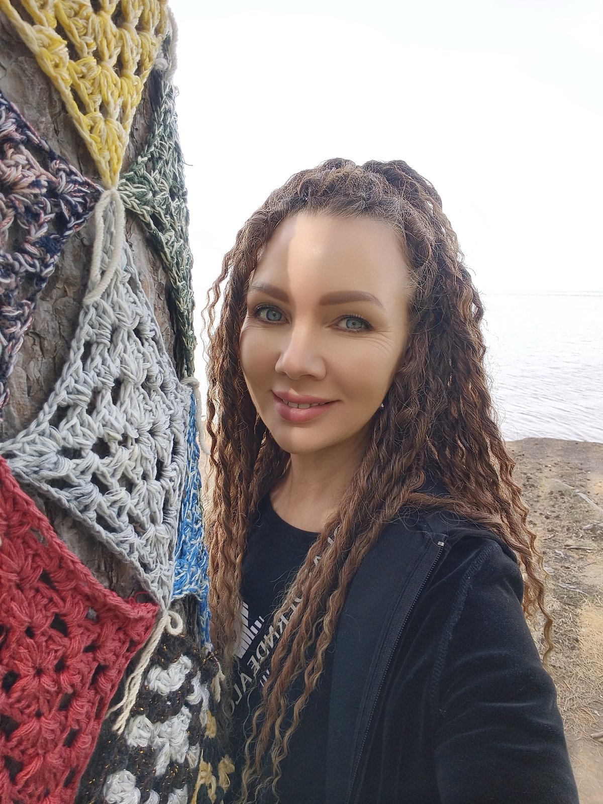 Woman documents morning lakeside forest visit with selfies and scenery