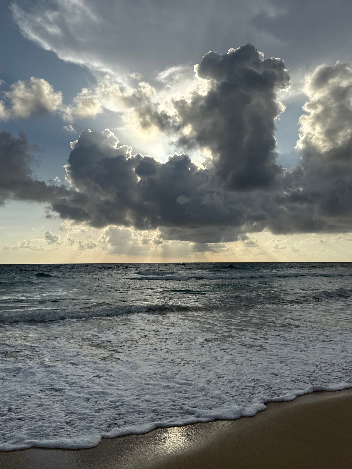 Karon Beach under a stormy sky, parasails and all