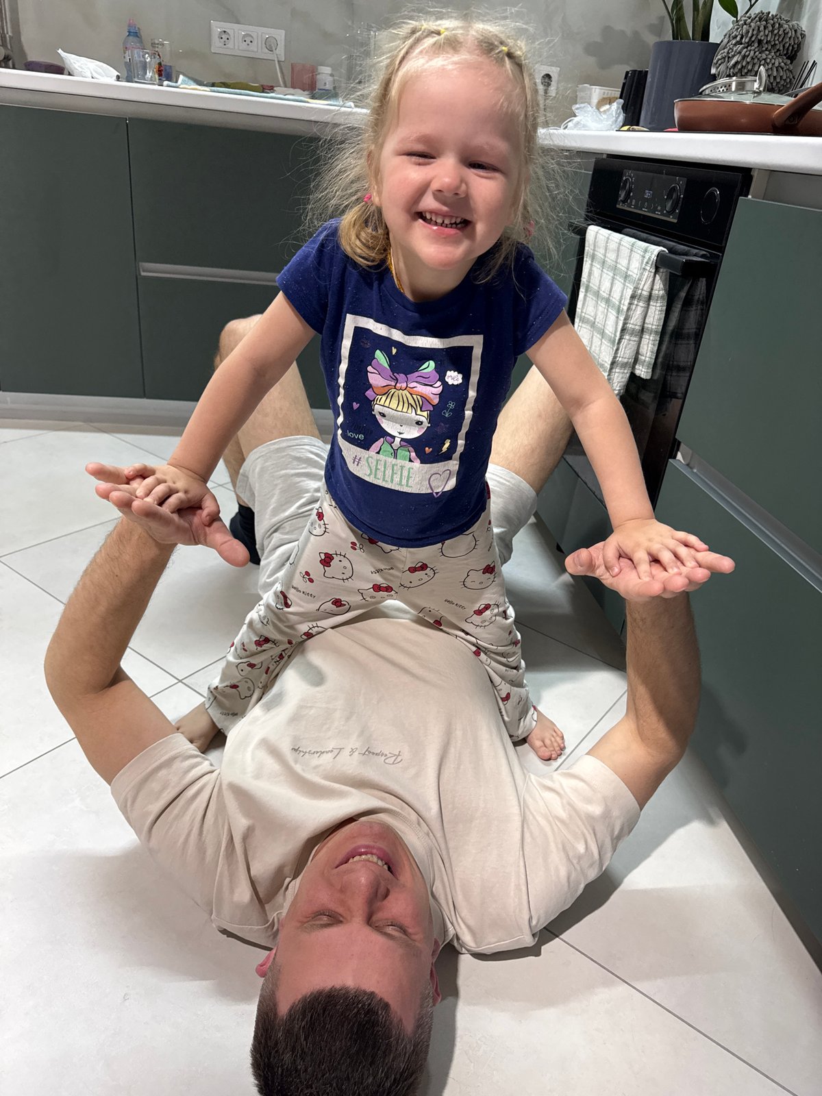 Father and daughter share playful moments at Russian home