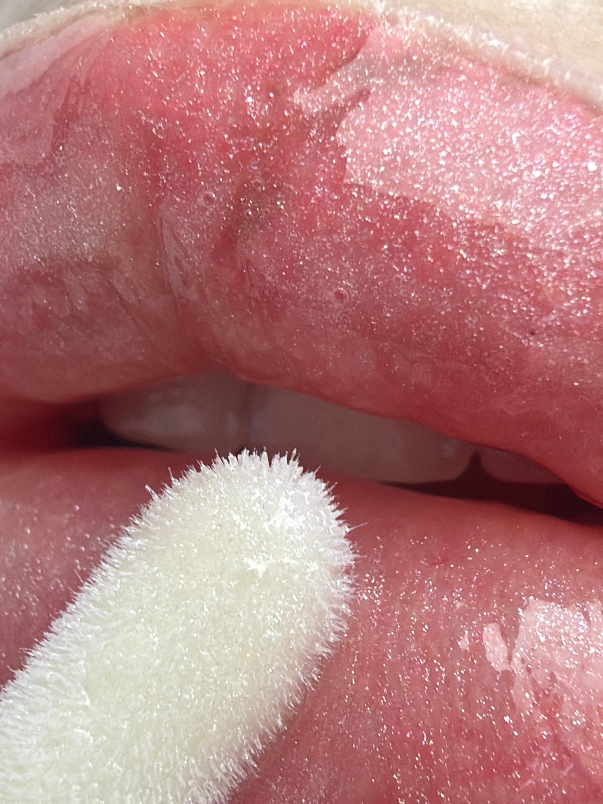 Person documents detailed skincare routine with lip gloss and masks