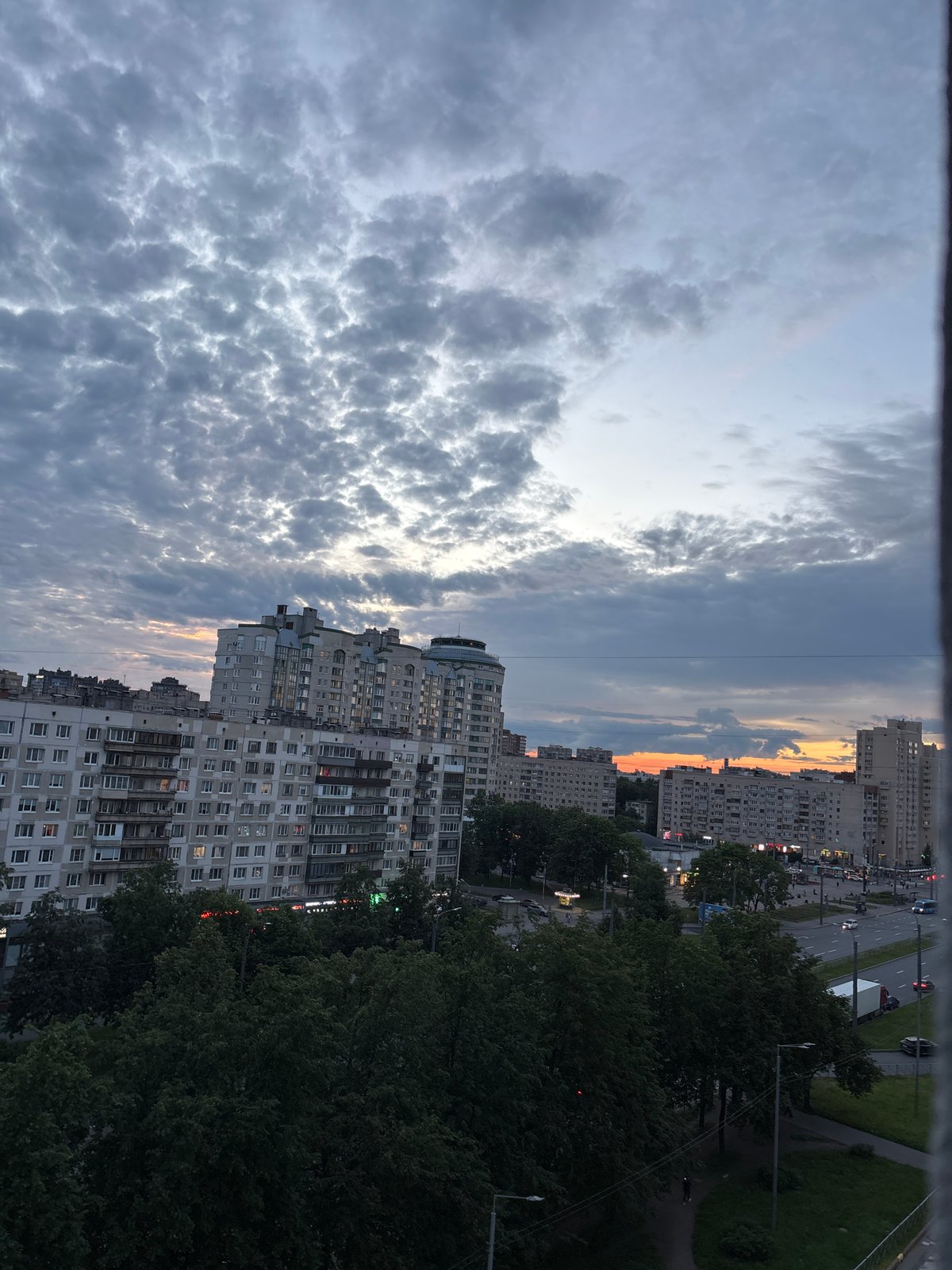 Dusk cityscape, two cats, and an indoor portrait at home