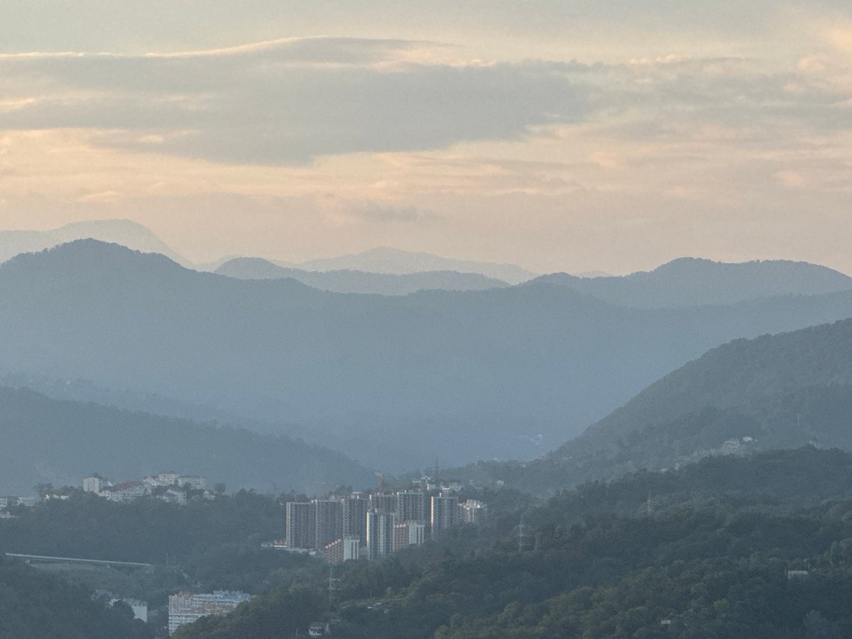 Evening views across Sochi's hillside neighborhoods and valleys