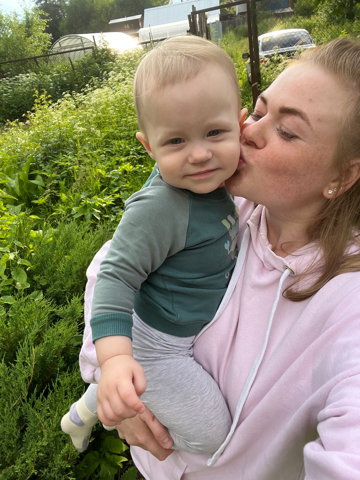 Tender outdoor moment with a baby in Chaikovsky