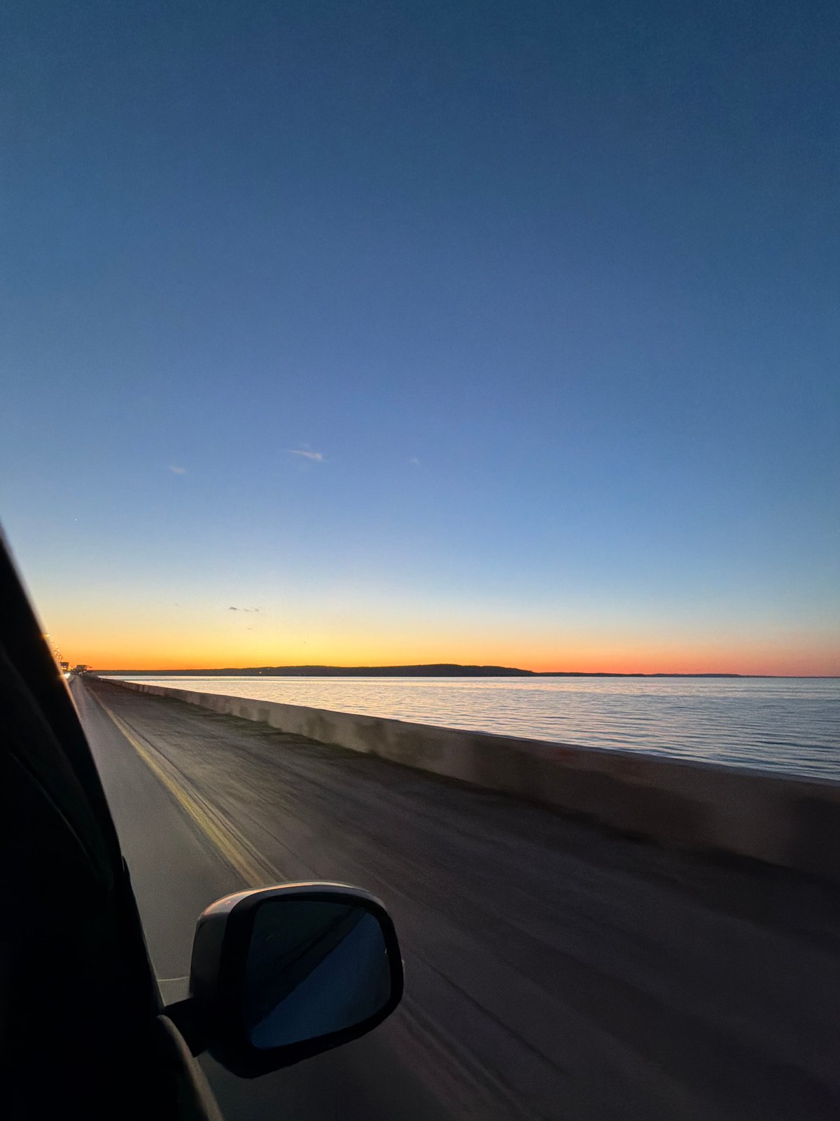 Driver captures sunset views during evening drive in Chaikovsky