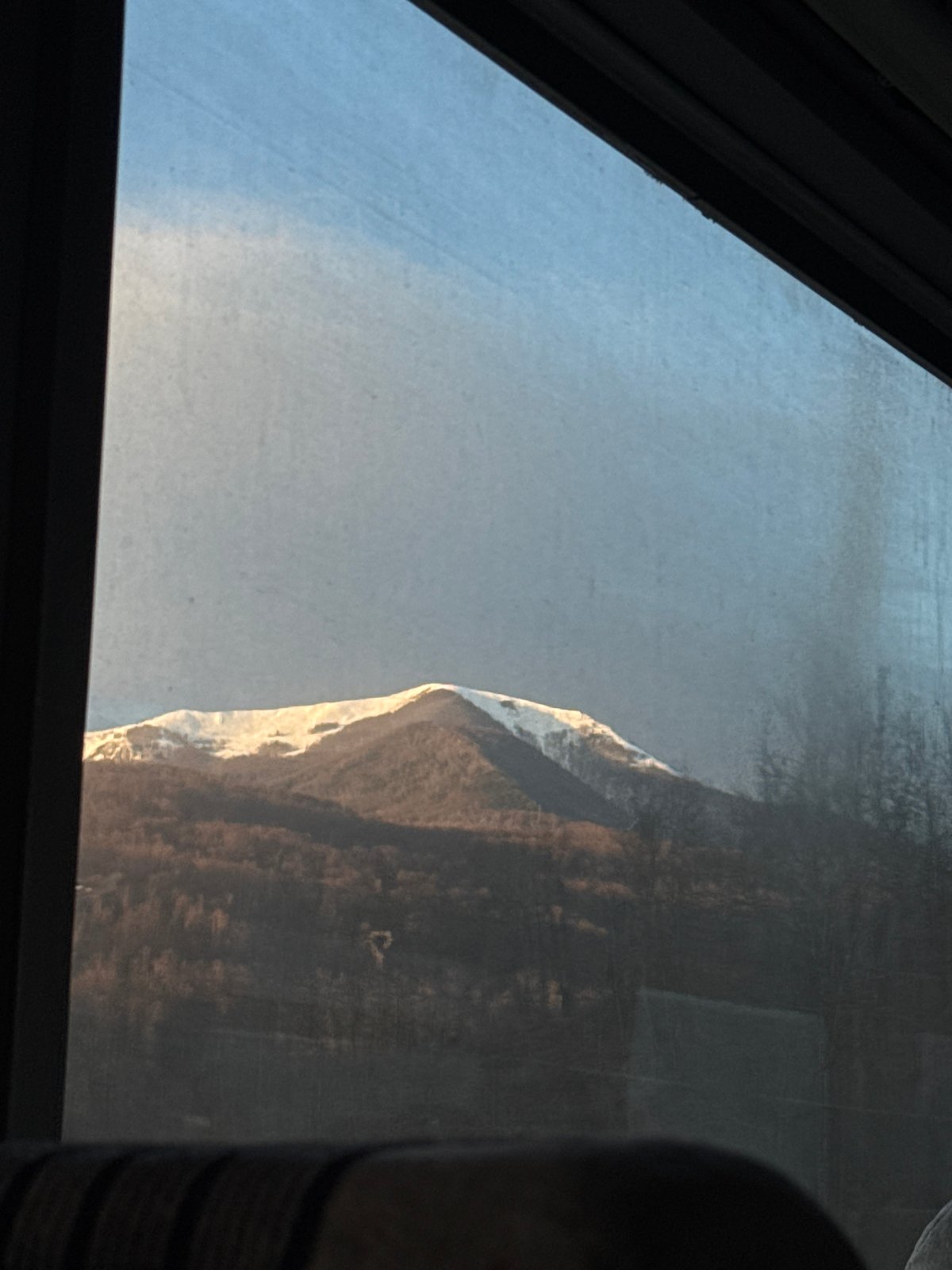 Mountain view with snow captured through window in Montenegro