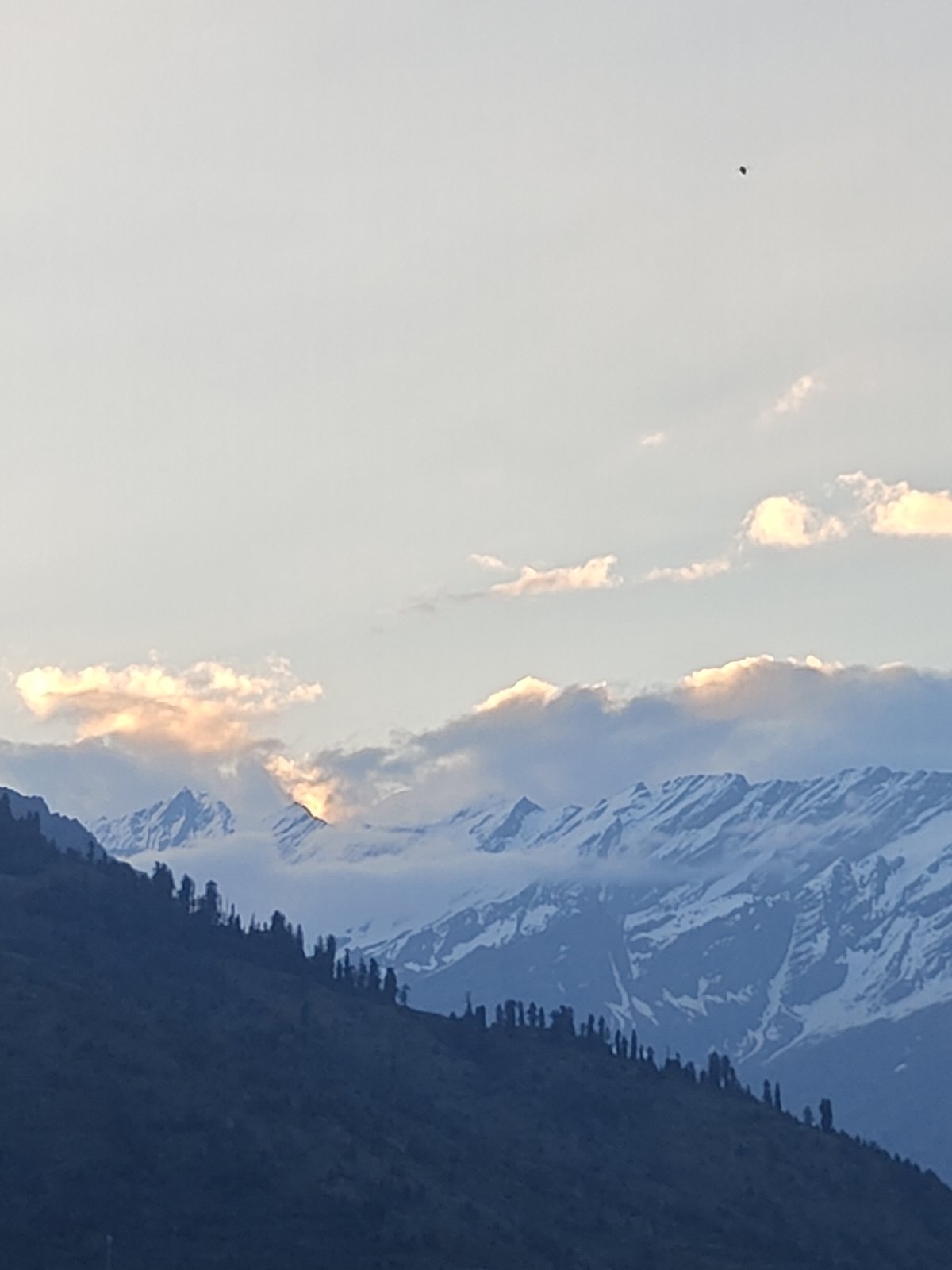 Tourist documents sweeping mountain vistas in Vashisht valley