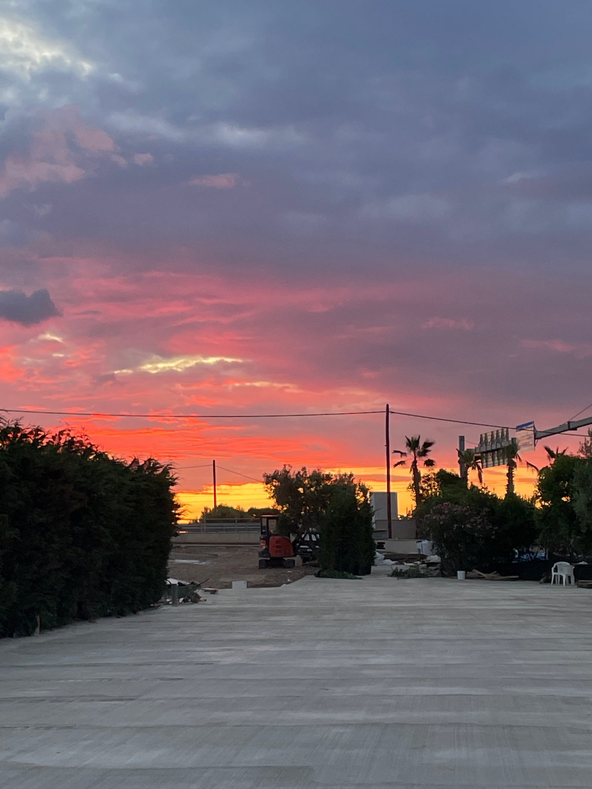 Sunset views and sleeping bulldog captured in Πόρτες, Greece