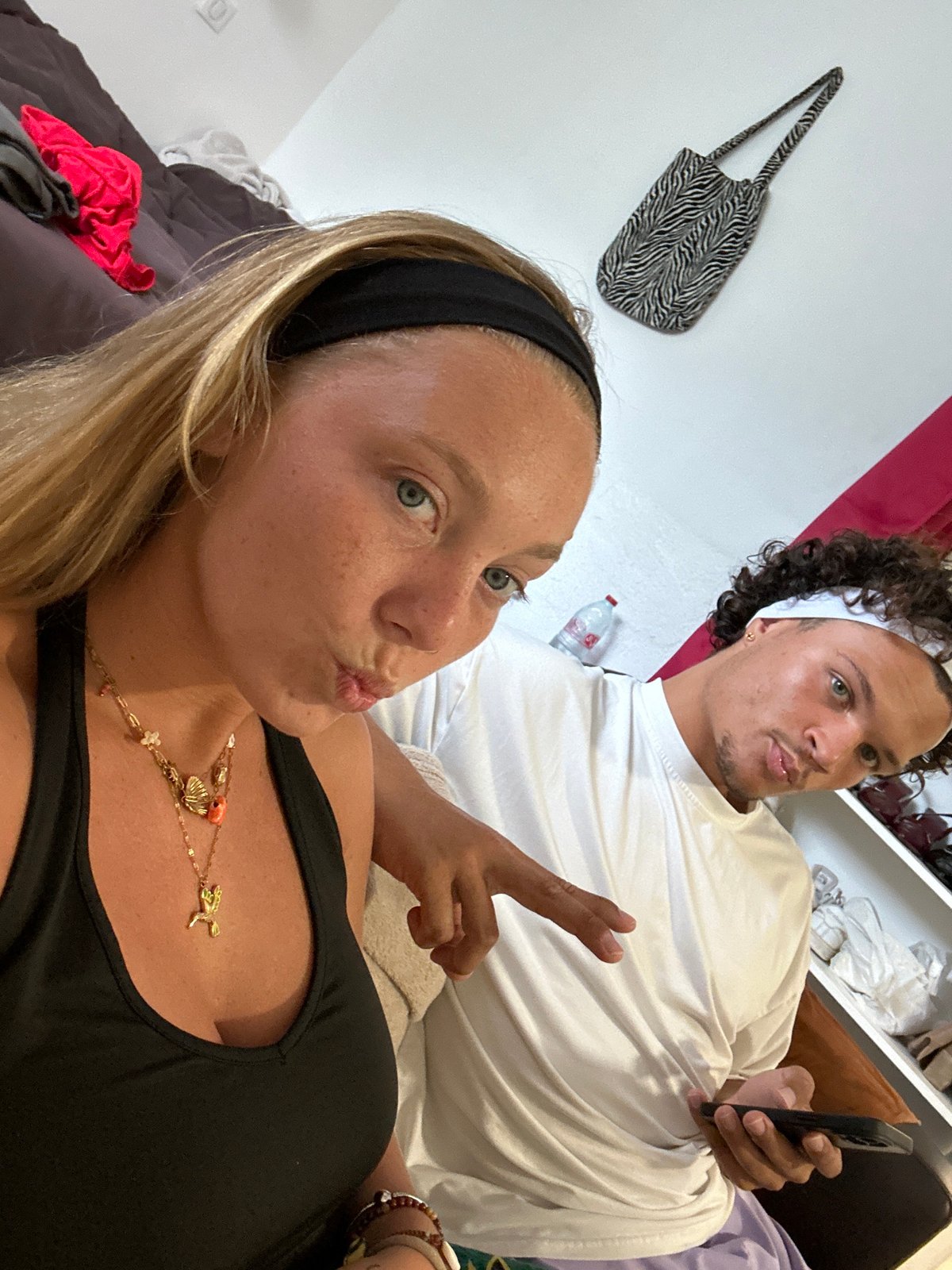 Two people take indoor selfie in Sainte-Anne
