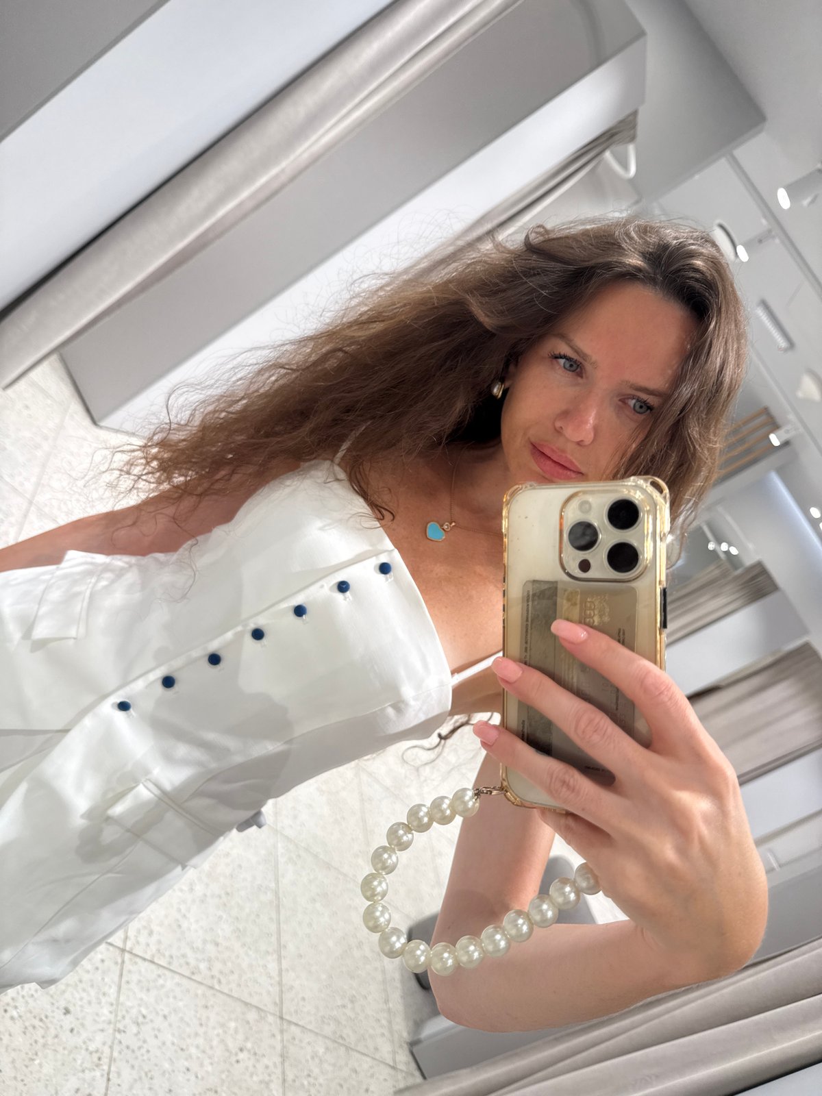 Fitting room try-on selfies in a Moscow clothing store