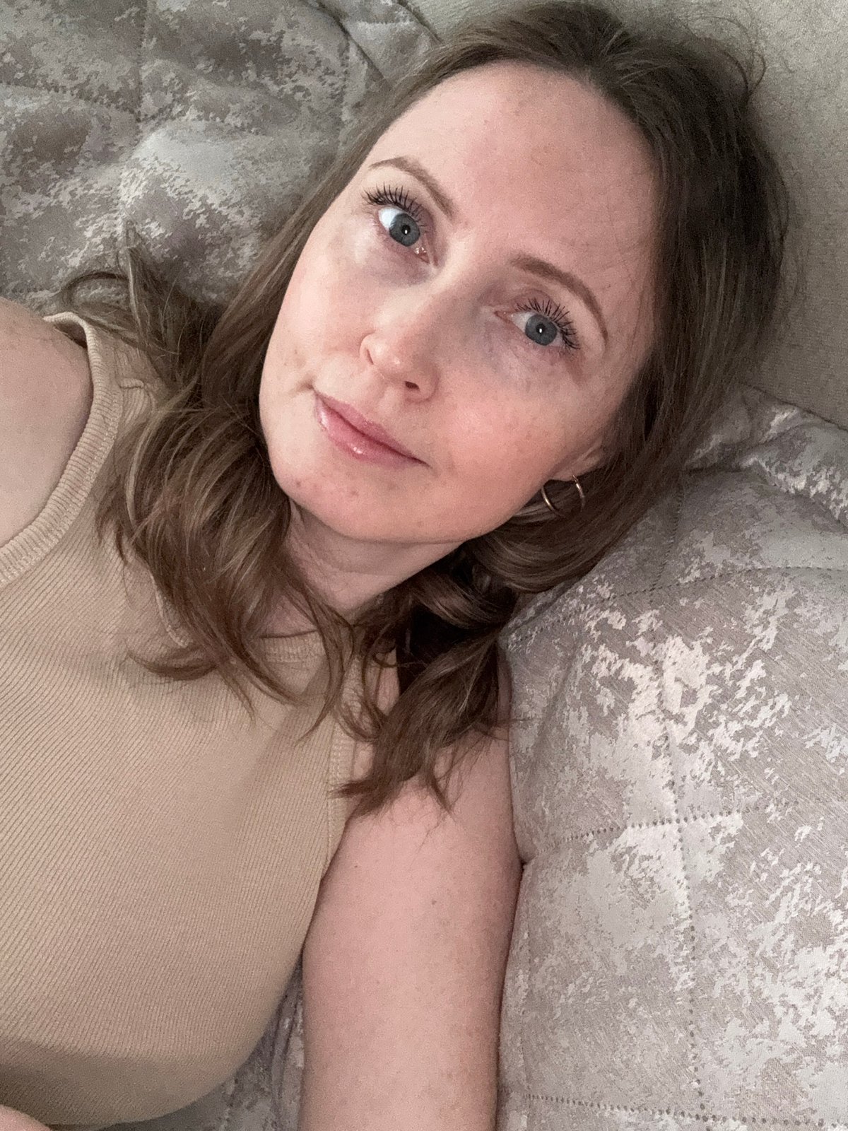 Woman observed resting indoors in Chaikovsky, Russia early morning
