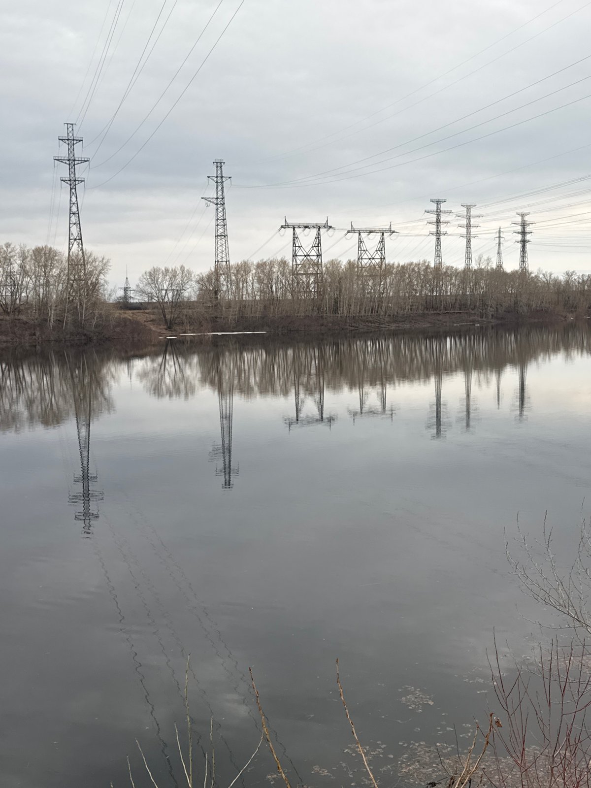 Upside-down river landscape with power lines captured in Chaikovsky