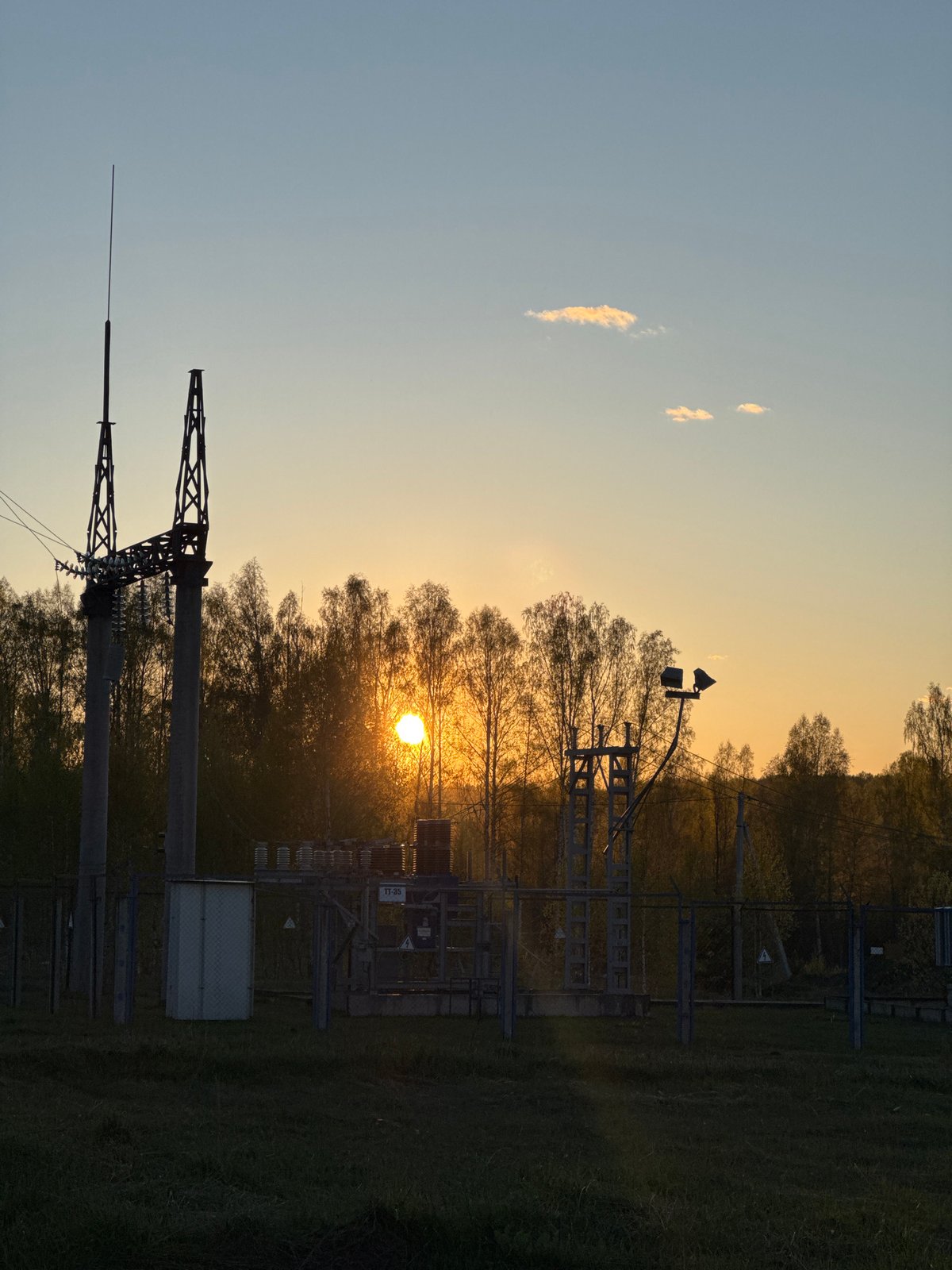 Sunset silhouettes electrical substation in Люкшудья, Russia